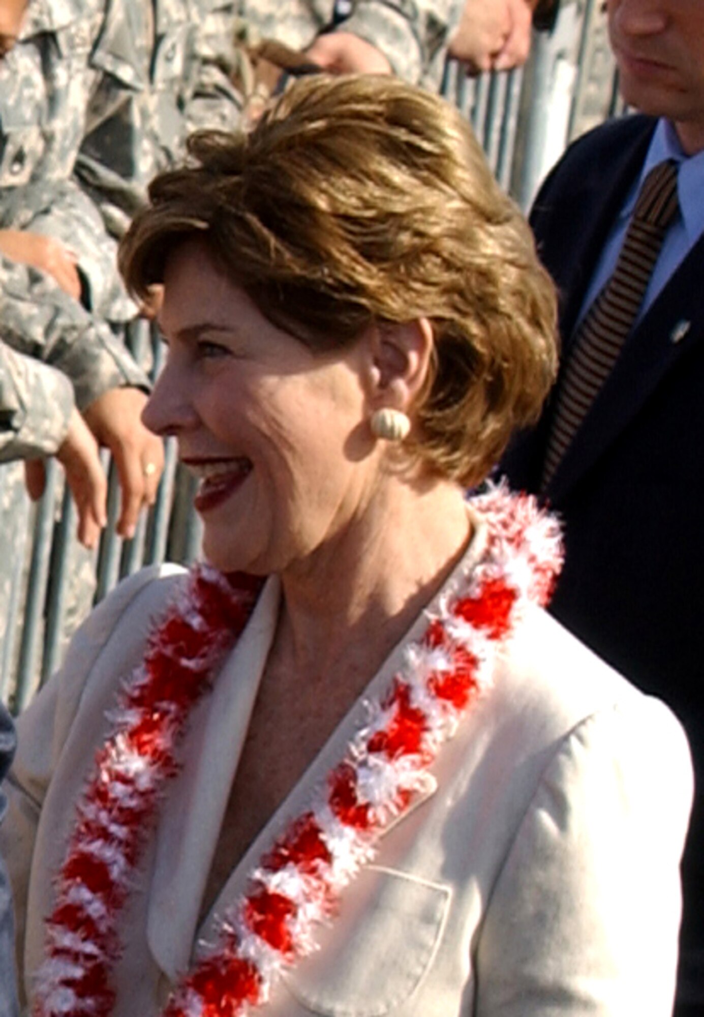 First Lady Laura Bush met with servicemembers, Nov. 21, on the Hickam Air Force Base flightline, before boarding Air Force One and heading back to Washington, D.C.  During the stopover Mrs. Bush used the opportunity to meet with servicemembers, retirees and family members to talk about the quality of life issues important to them. (U.S. Air Force photo/Angela Elbern) 
   