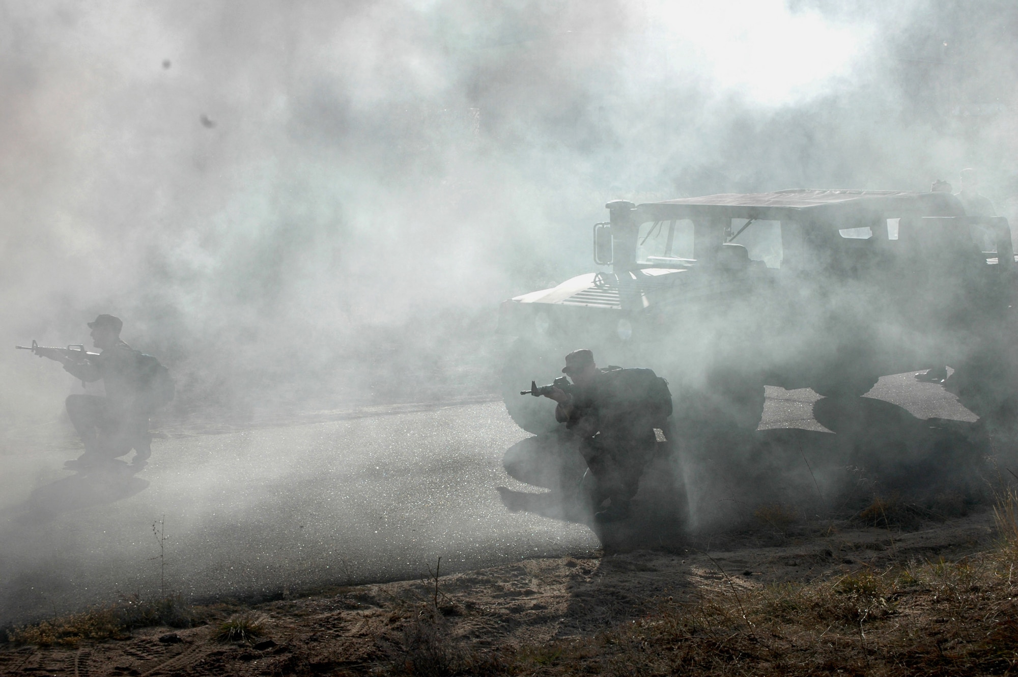 Air Force Academy cadets react during an exercise scenario in a mock war zone in nearby Jacks Valley Nov. 19 during the annual Commandant's Challenge at the Academy in Colorado Springs, Colo.  (U.S. Air Force photo/Cadet 2nd Class Erinn Woodside)