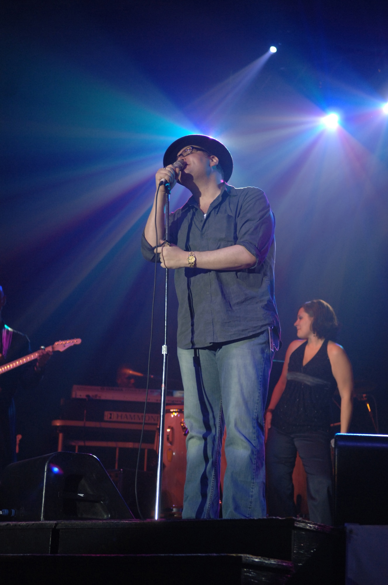 John Popper of the platinum-selling group, Blues Traveler, sings to more than 500 members of Team Incirlik during the Operation Season's Greetings concert Nov. 22 at Incirlik Air Base. The OSG Tour made its first stop at Incirlik bringing country music artist Jamie O'Neal, entertainer of the air waves Delilah, John Popper of Blues Traveler, the New England Patriots cheerleaders and the U.S. Air Forces in Europe and Reserve bands. (U.S. Air Force photo by Airman 1st Class Nathan Lipscomb)