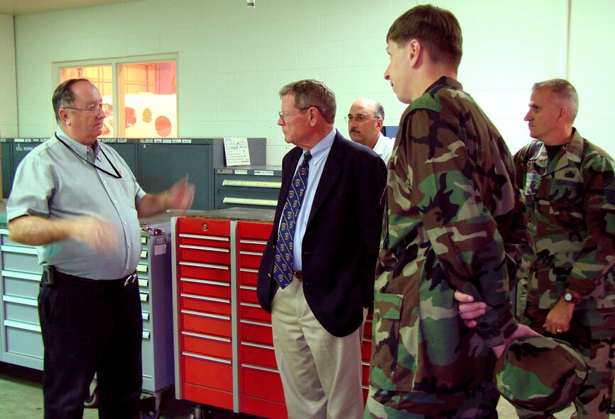 (Photo by Capt. Tony Wickman) Dave Davis, Computer Science Corporation, director of aircraft maintenance, briefs Sen. James Inhofe on the current fuel cell facility at Vance Air Force Base. To the right of the senator are Greg Cohlmia, CSC, fuel shop lead,  Col. Richard Klumpp, Jr., 71st Flying Training Wing commander, and Senior Master Sgt. Dieter Halper, 71st FTW maintenance quality assurance. Senator Inhofe visted with wing leadership and toured the base Tuesday.  
