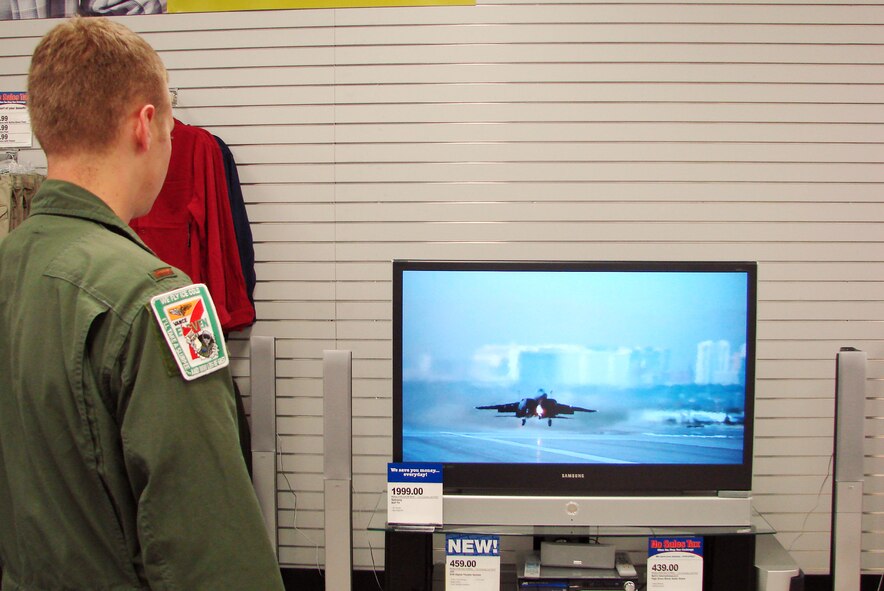 (Photo by Frank McIntyre) A student pilot looks at an entertainment display at the Vance Base Exchange Tuesday. The new BX manager is looking for feedback from customers to use in improving the exchange. 