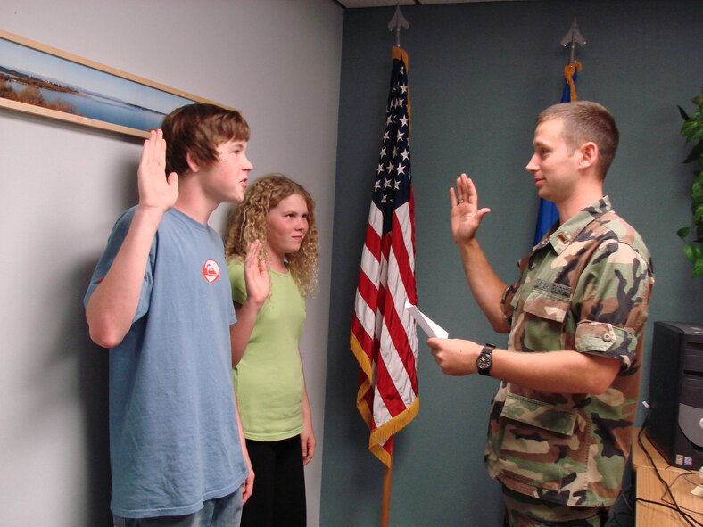 (Photo by Staff Sgt. Amanda Savannah) Ethan and Emily Suttles are “sworn in” by 2nd Lt. Nick Varner, Operation KIDS project officer, Tuesday to participate in the event 8 a.m. to 1 p.m. Oct. 19. The hands-on event is designed to give children in military families and understanding of what their parent or parents experience prior to and during a deployment.