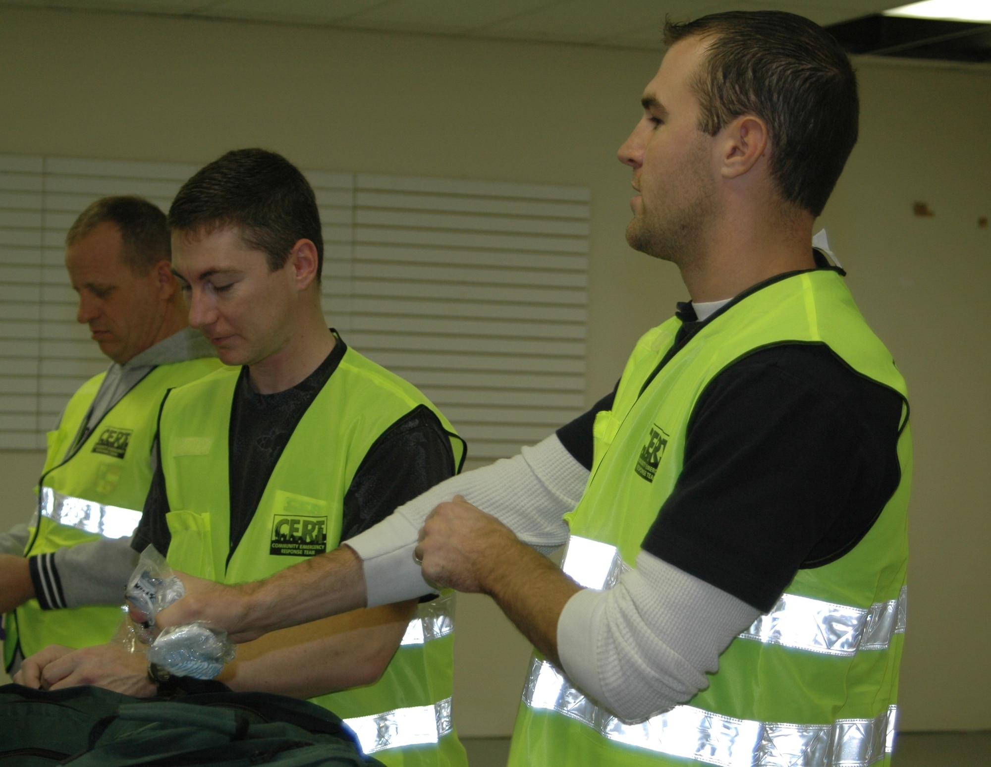 Tech. Sgt. Edward Mackiel and Senior Airman Joshua Jankowski, 819th RED HORSE Squadron, prepare their CERT bags to enter the simulated disaster area.