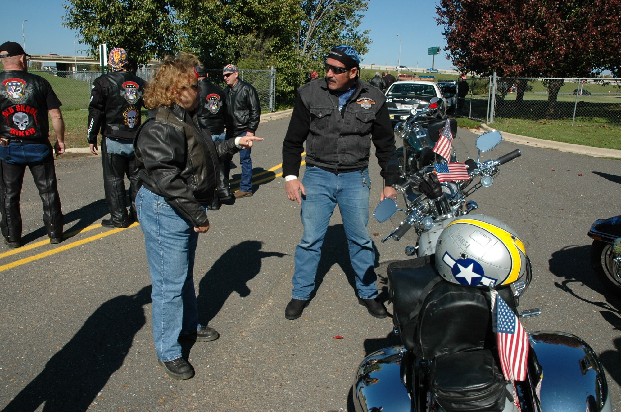 Charles Strozier, a technical sergeant and member of the 717th Aircraft Maintenance Squadron, and Brenda Towers discuss modifications to her 2003 Harley Davidson V-Rod named “Miss Betsy”, one of two military tribute motorcycles that participated in the Veterans for Veterans Bike Event Nov.11, 2006, held at Overton Brooks Veterans Administration Hospital in Shreveport, La. (U.S. Air Force photo/Master Sgt. Gerry Currington)