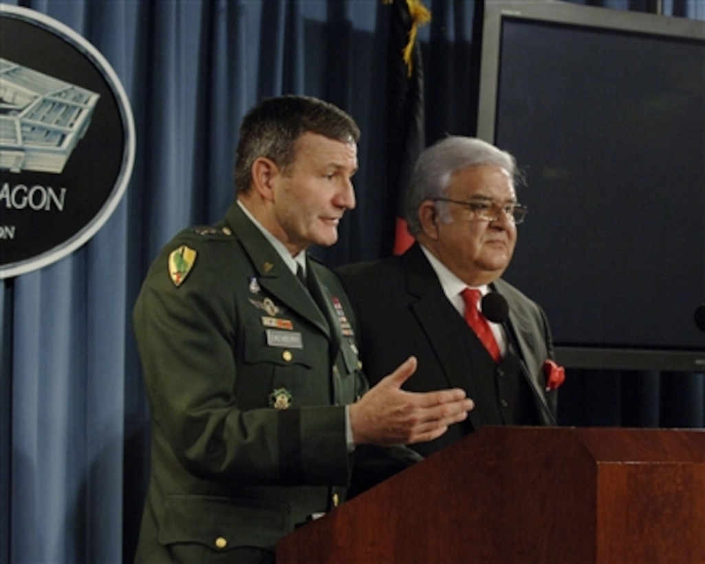 Commander of Combined Forces Command, Afghanistan Lt. Gen. Karl Eikenberry (left), U.S. Army, and Afghan Minister of Defense Gen. Abdul Rahim Wardak (right) conduct a press briefing in the Pentagon on Nov. 21, 2006.   