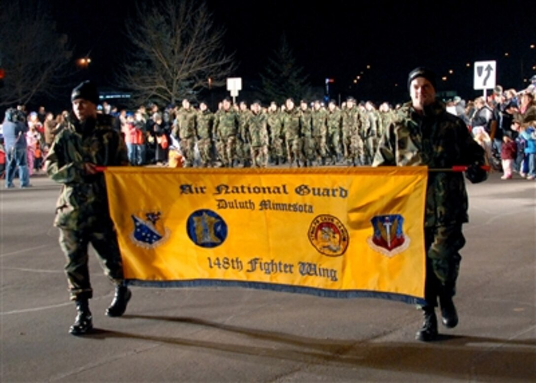 More than 100 airmen from the 148th Fighter Wing, Minnesota National Guard, march as the opening element of the Christmas City of the North Parade in Duluth, Minn., Nov. 17, 2006.