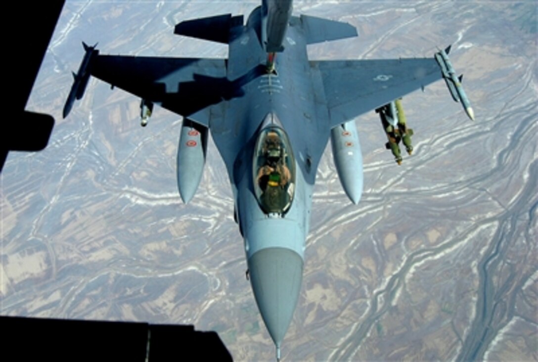 An F-16 Fighting Falcon from Balad Air Base, Iraq, takes fuel from a KC-10 Extender over Iraq Nov. 20, 2006. The KC-10 refueled two jets that afternoon in support of Operation Iraqi Freedom.