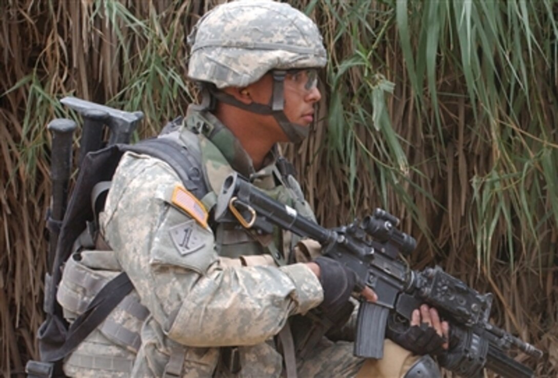 U.S. Army Sgt. Kenny Alicea provides security during Operation Snake Hunter in Muqdadiyah, Iraq, Nov. 19, 2006. Alicea is assigned to the 1st Cavalry Division's Troop C, 6th Squadron, 9th Calvary Regiment.