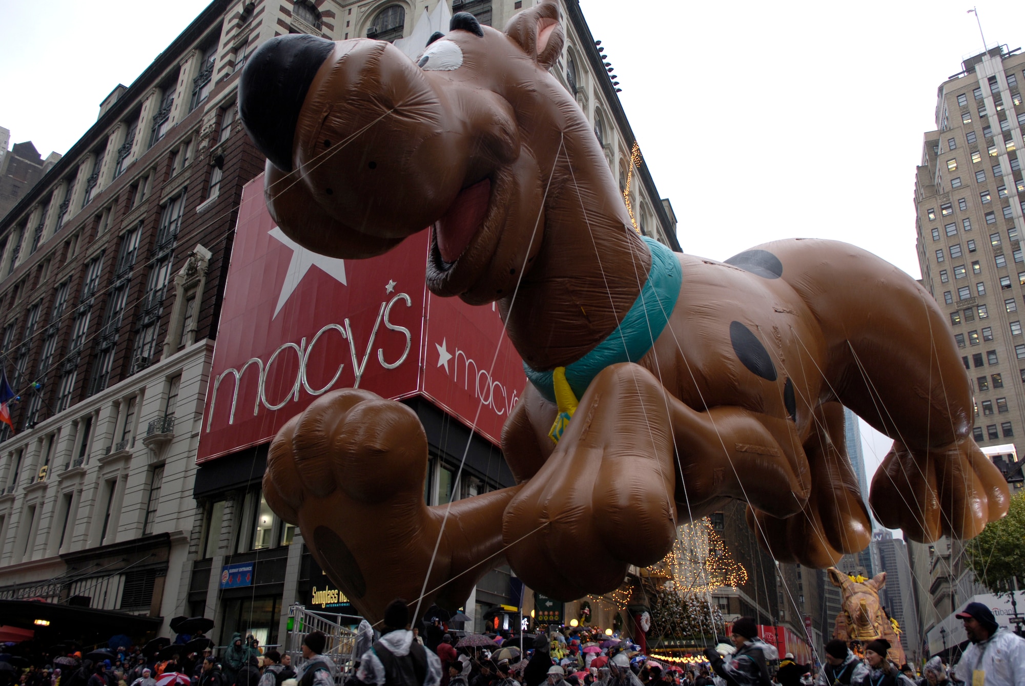 The Scooby-Doo balloon rounds the corner of Broadway and 34th Street at the 80th Macy's Thanksgiving Day Parade in New York City, N.Y., Nov. 23.  The U.S. Air Force Academy Marching Band participated in the parade. (U.S. Air Force photo/Senior Airman Brian Ferguson)
