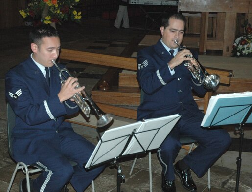 Senior Airman Pat Brush (left) and Staff Sgt. Chris Cronsell play at the annual Thanksgiving service at Ely Cathedral in the United Kingdom. The two Airmen are members of the U.S. Air Forces in Europe Five Star Brass Band. (U.S. Air Force photo/Tech. Sgt. Scott Wakefield)
