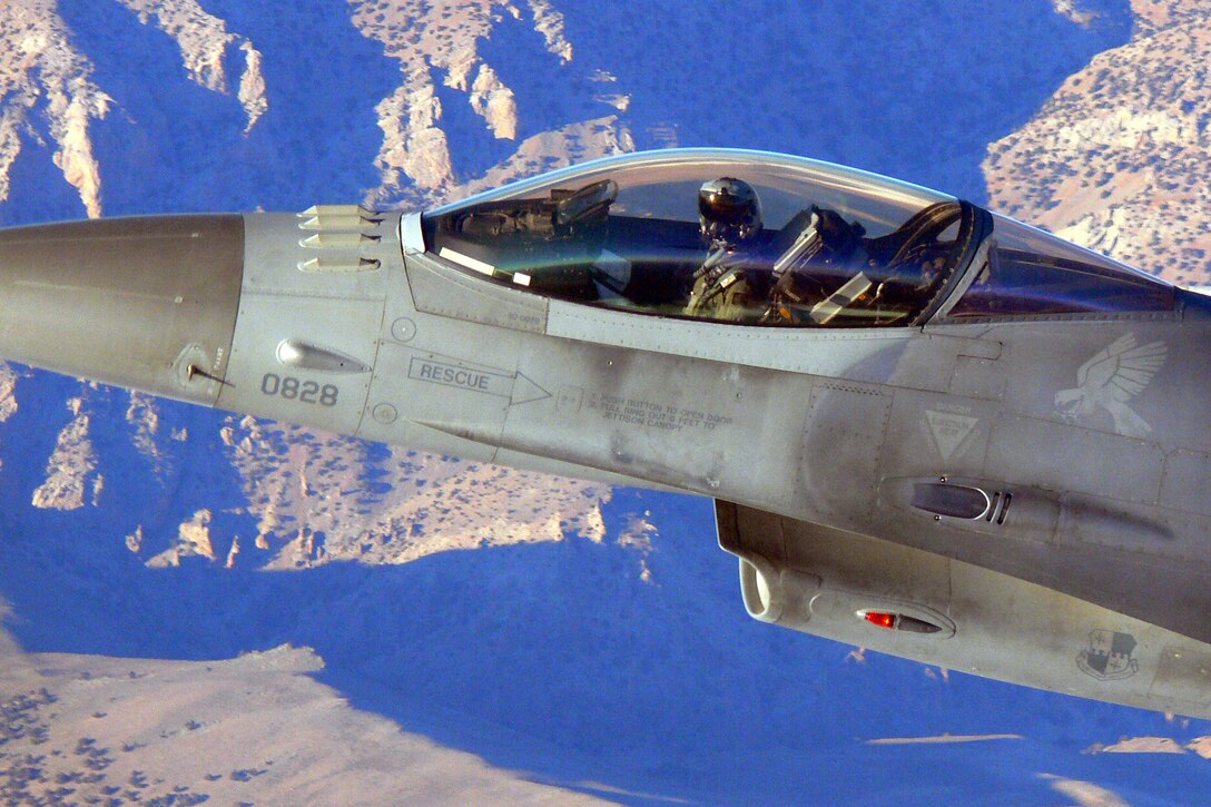 Col. Darryl Roberson pulls into tight formation with another F-16 Fighting Falcon over the Turkish mountains after completing the final mission of Exercise Anatolian Eagle, conducted at Konya Air Base. Colonel Roberson is commander of the 52nd Fighter Squadron at Spangdahlem Air Base, Germany. (U.S. Air Force photo/Master Sgt. Ron Przysucha)