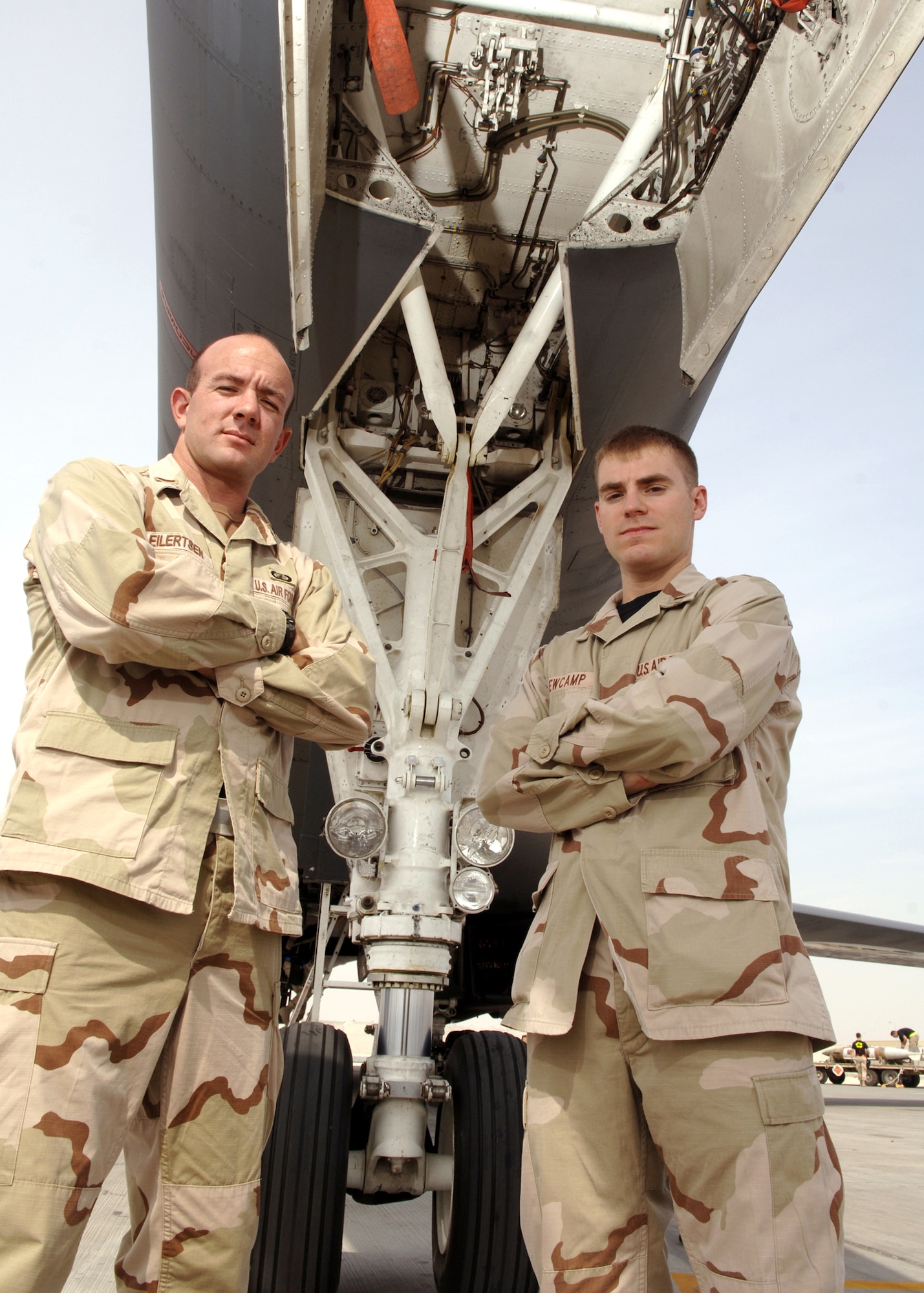 Second Lt. Mark Eilertsen and 1st Lt. Jeffrey Newcamp, depot liaison engineers with the 379th Expeditionary Maintenance Operations Squadron, pose in front of a B-1 Lancer at a base in Southwest Asia. (U.S. Air Force photo/Senior Airman Ricky Best) 
