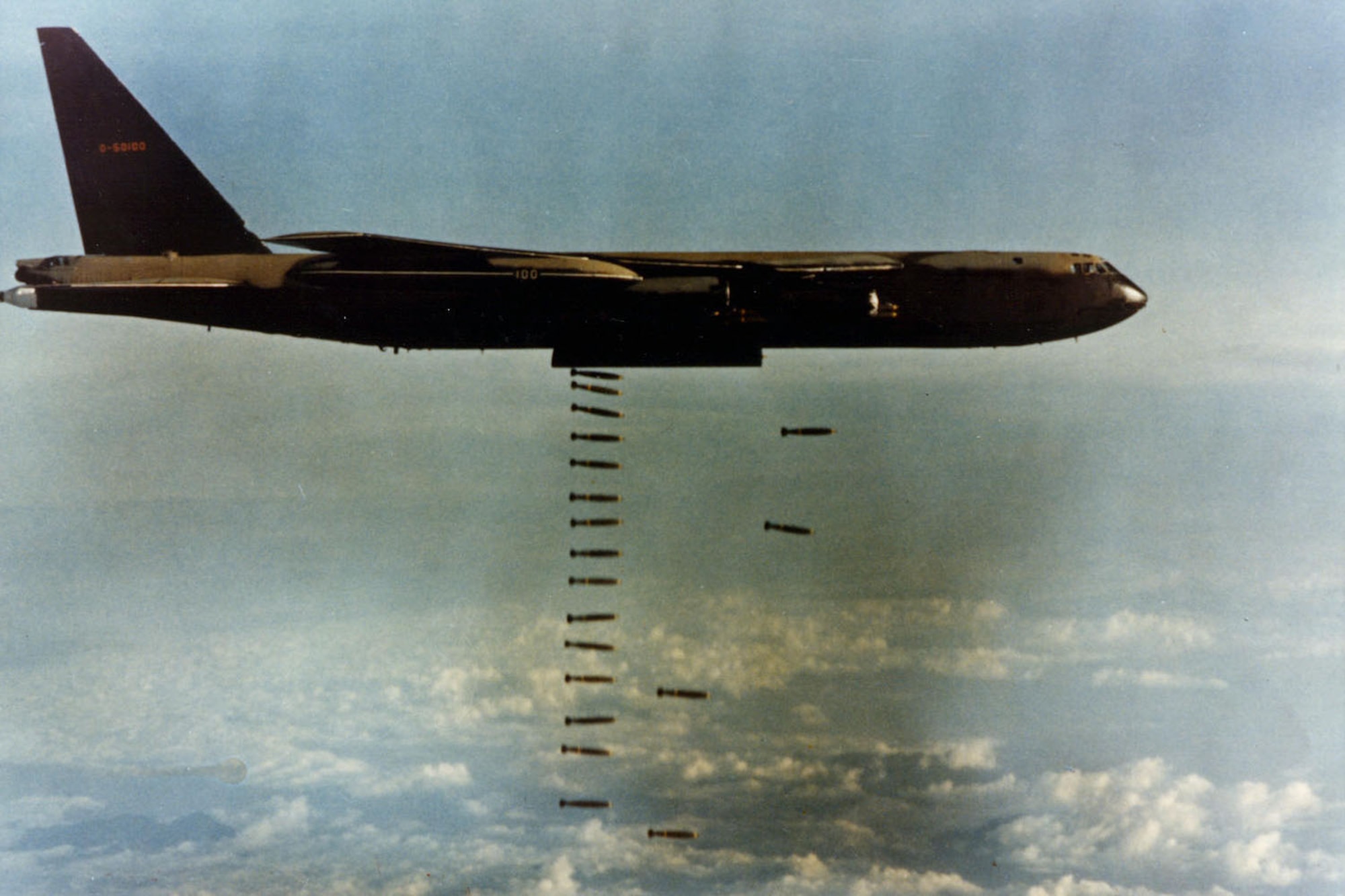 One of the “Big Belly” B-52Ds releasing its 60,000-pound bomb load of bombs on enemy targets in Vietnam. It could carry up to 84 500-pound bombs or 42 750-pound bombs internally and 24 750-pound bombs externally on racks under the wings. (U.S. Air Force photo)