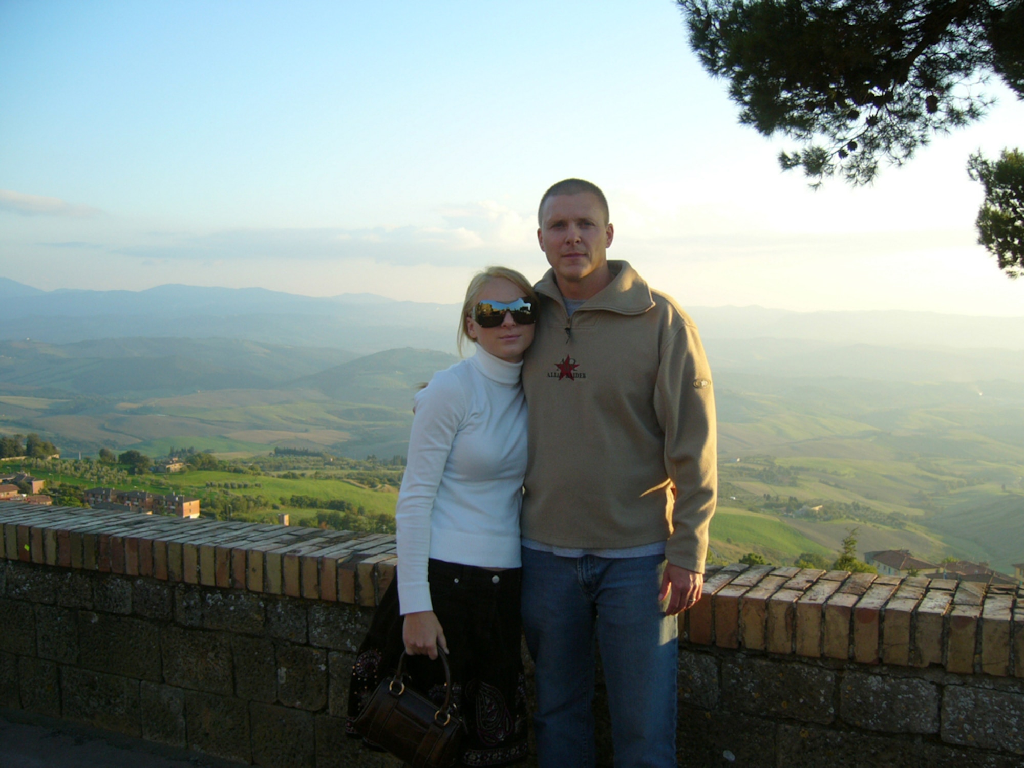 From left, Airman 1st Class Anete and Master Sgt. Shannon Adams visit the countryside in rural Tuscany, Italy. The couple met in Germany while Sergeant Adams was stationed in Italy. They married in 2002. Airman Adams was born in Lativa and has also lived in both Germany and Italy. (Courtesy Photo)