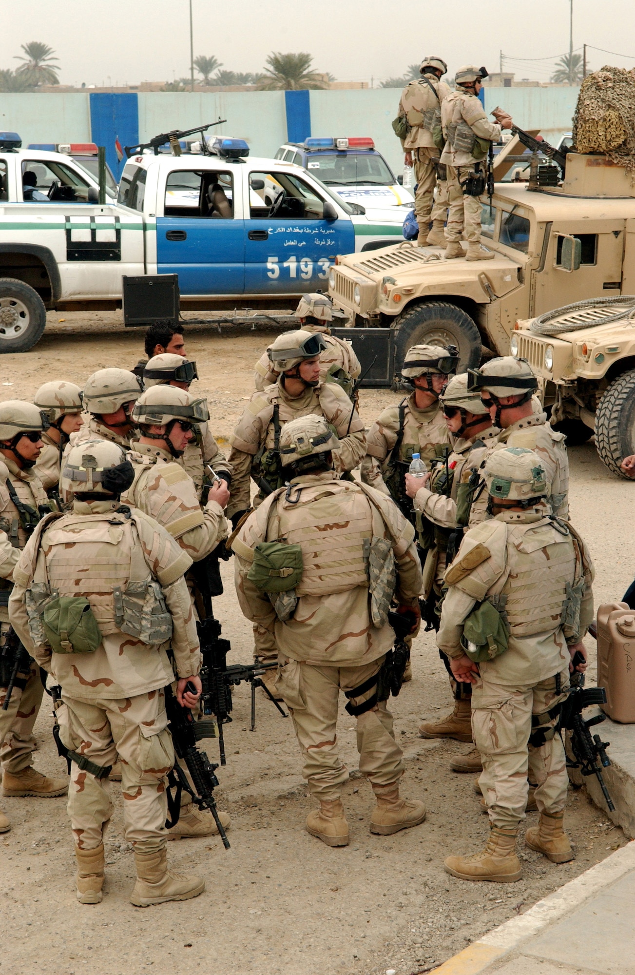 Airmen from the Detachment 7, 732nd Expeditionary Security Forces Squadron conduct a mission brief at the Hy Al-Amil police precinct Nov. 23 in Baghdad, Iraq. Airmen from from the unit deploy into the city streets of Baghdad assisting Iraqi police in achieving self-sufficiency. (U.S. Air Force photo/Master Sgt. Steve Cline) 
