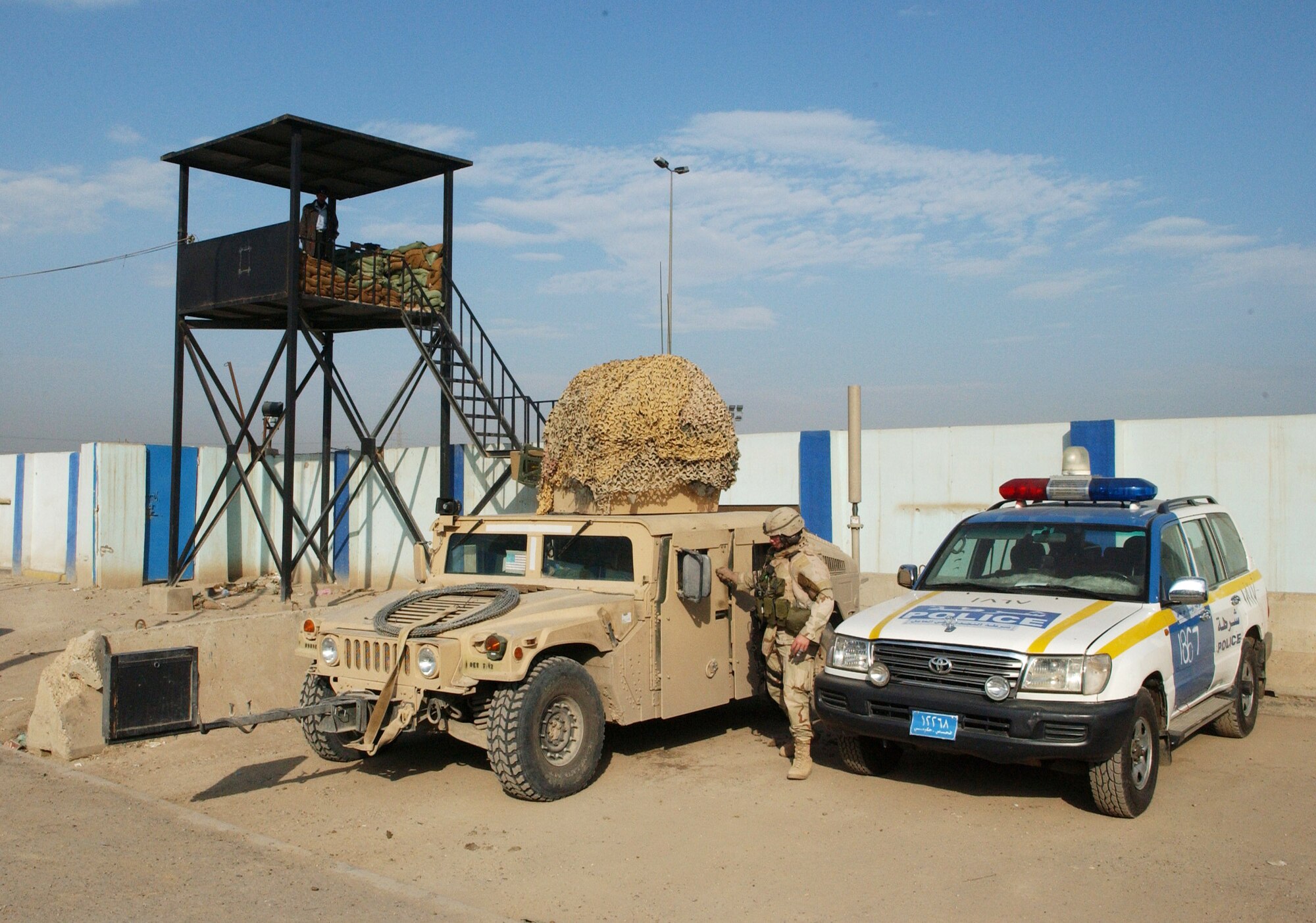 An Air Force high mobility multi-purpose vehicle arrives at the Hy Al-Amil station Nov. 23 in Baghdad, Iraq. Airmen from Detachment 7, 732nd Expeditionary Security Forces Squadron deploy into the city streets of Baghdad assisting Iraqi police in achieving self-sufficiency. (U.S. Air Force photo/Master Sgt. Steve Cline)