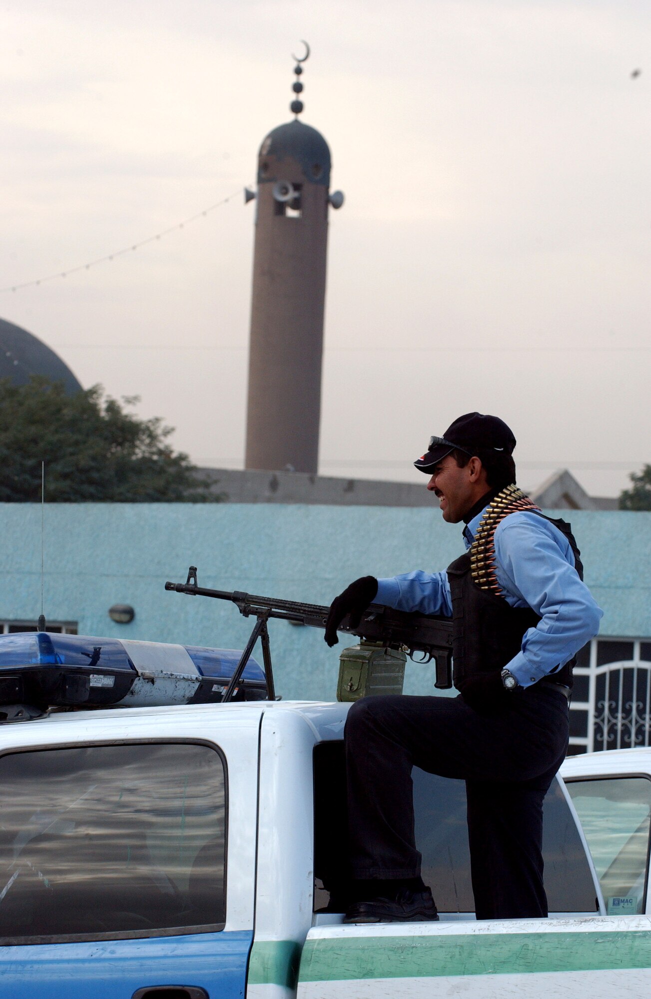 An Iraqi police officer stands ready for a patrol at the Hy Al-Amil station Nov. 23 in Baghdad, Iraq. Iraqi policemen work with Airmen from Detachment 7, 732nd Expeditionary Security Forces Squadron, whose mission is to deploy into the city of Baghdad assisting Iraqi police in achieving self-sufficiency. (U.S. Air Force photo/Master Sgt. Steve Cline)