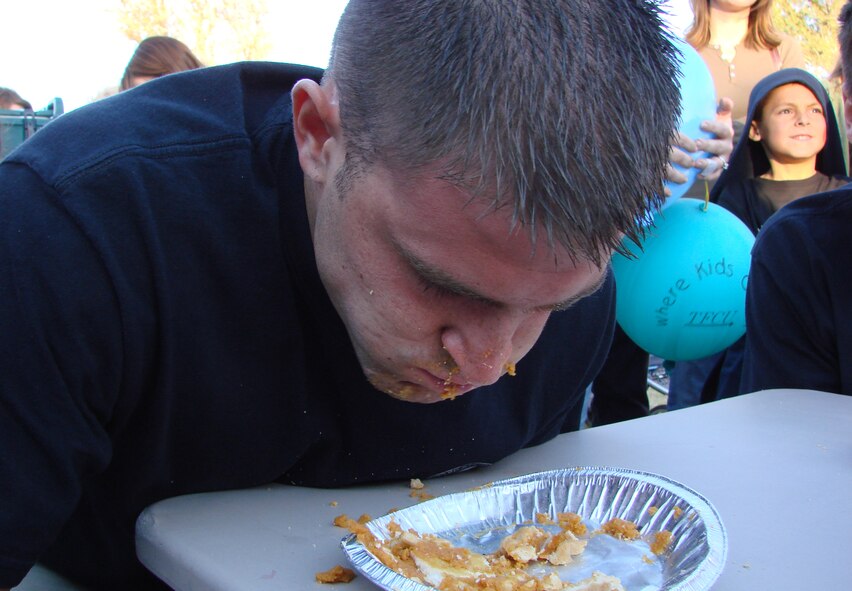 (Photo by Frank McIntyre) Senior Airman Dominic Dangora, 71st Medical Operations Squadron, probably was not in the mood for the complimentary hot dogs after his second place finish in the pumpkin pie eating contest.