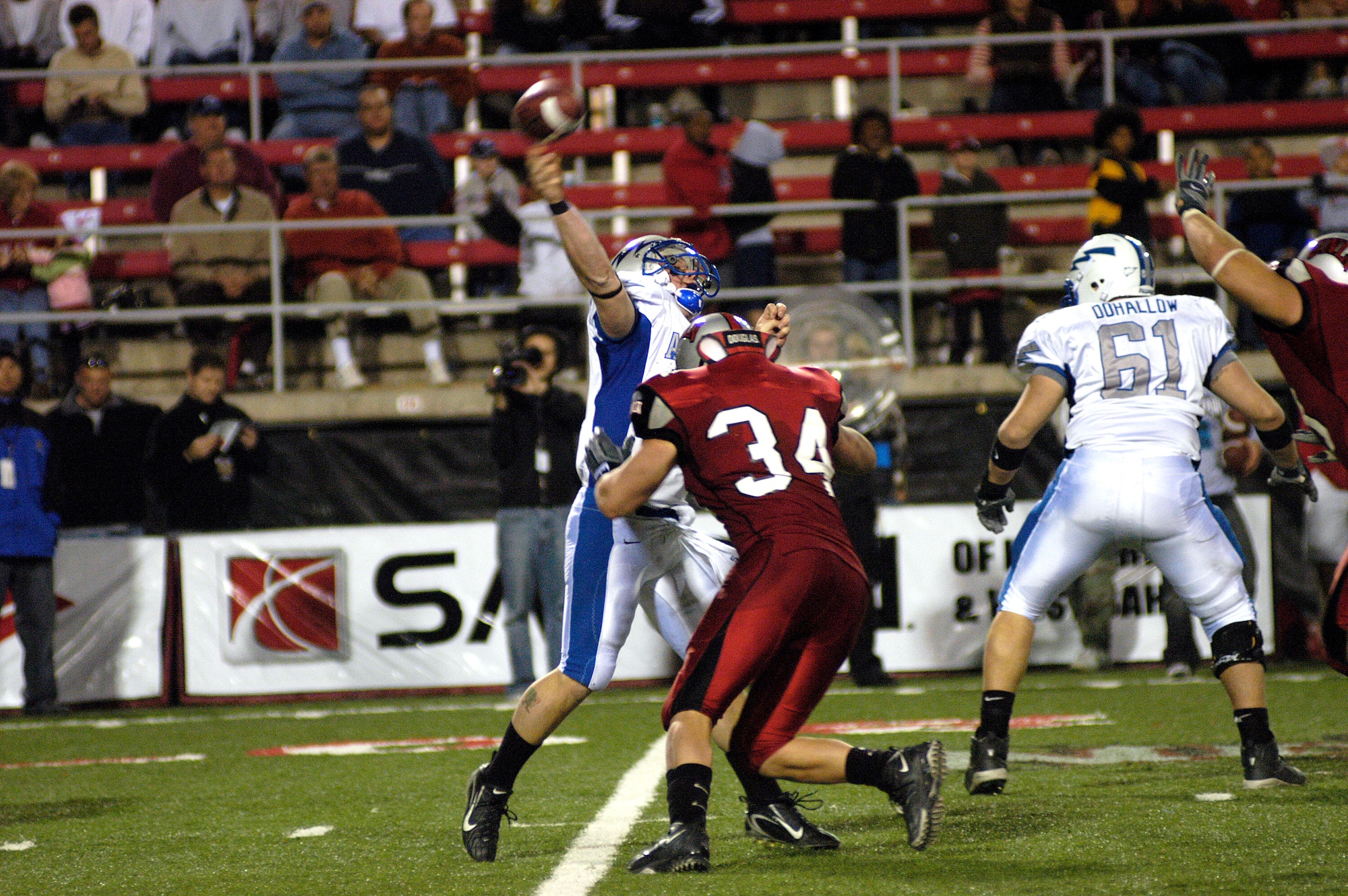 University of Nevada-Las Vegas linebacker Matt Pattison tackles Air Force quarterback Shaun Carney as he tries to complete a pass Nov. 24 in Las Vegas. The UNLV Runnin' Rebels amassed 555 yards in total offense to defeat the Falcons 42-39. (U.S. Air Force photo/Cadet 2nd Class Paul Russo) 