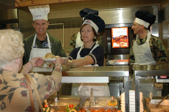 Gen. Kevin Chilton, Air Force Space Command commander, and his wife, Cathy, serve Thanksgiving dinner to a retiree Thanksgiving Day at the Aragon Dining Facility on Peterson Air Force Base. Airmen, families and retirees shared a Thanksgiving meal at the facility. (U.S. Air Force Photo by Senior Airman Jessica Switzer) 