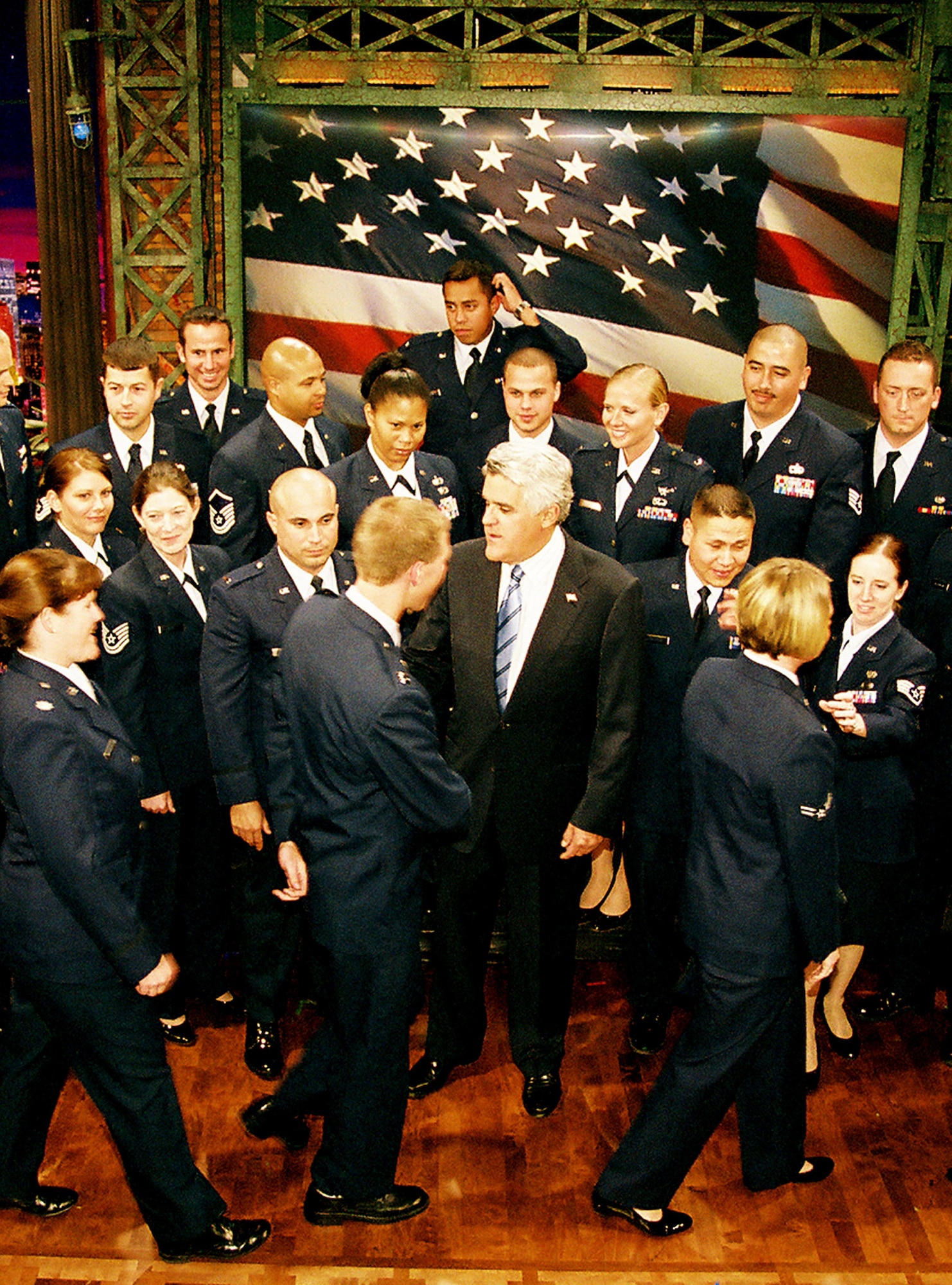 Vandenberg Airmen introduce themselves to Jay Leno before posing for a picture on the set of "The Tonight Show" after the taping of the Nov. 22 Thanksgiving episode.  Mr. Leno invited members of all five military branches to the show in appreciation of their service and dedication to the United States.  Jesse James of Discovery Channel's "Monster Garage" also appeared to say thank you to the servicemembers on hand.