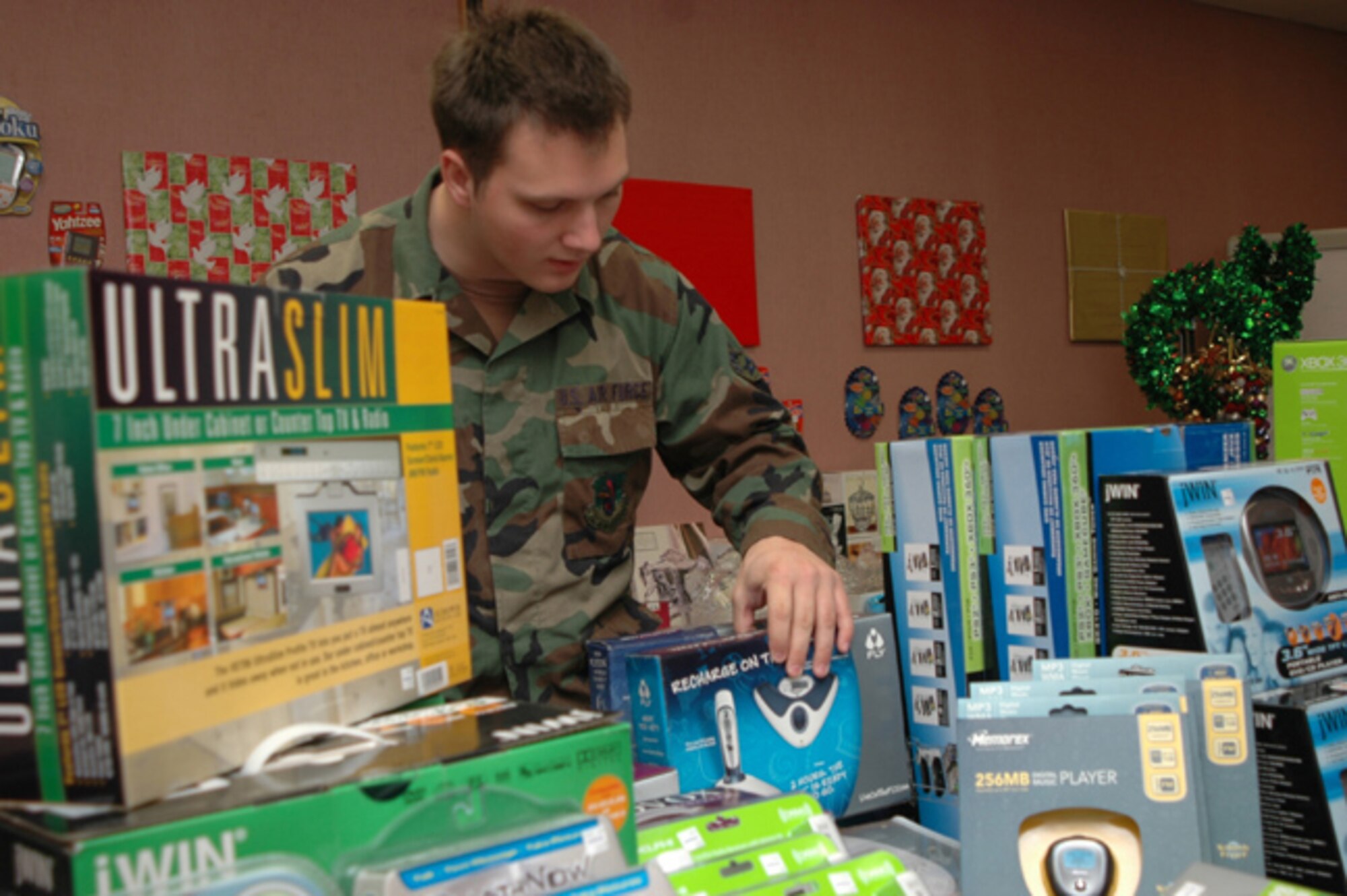GRISSOM AIR RESERVE BASE, Ind. --Senior Airman Ryan Montgomery of the 434th Maintenance Squadron looks through the electronics gifts available for sale at the  special Christmas store operated by the Base Exchange.   The store will be open  Dec. 1 from 11 am to 2 pm; Dec. 2 from 9 am to 4 pm and Dec. 3 from 10 am to 4 pm.  (U.S. Air Force photo/ Senior Airman Chris Bolen)