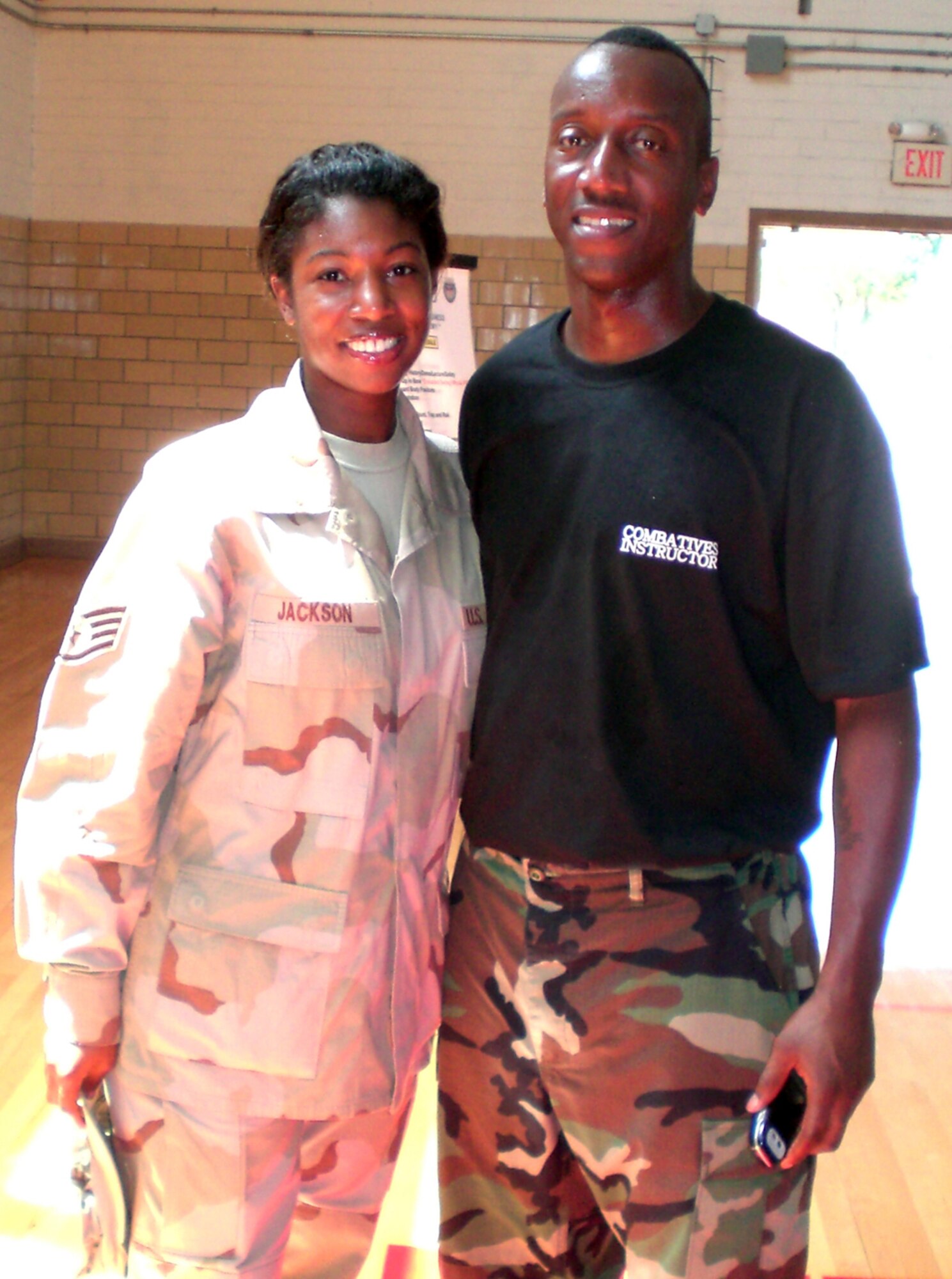 Staff Sgt. Georgette Jackson, 66th Mission Support Squadron Customer Service noncommissioned officer in charge, poses with her brother, Army Level I Combatives Instructor Staff Sgt. Gary Williams. The siblings were reunited while Sergeant Jackson was deployed to Fort Sill, Okla., where Sergeant Williams is stationed. They had not seen each other in person for 20 years before their accidental meeting in May. (Courtesy Photo)