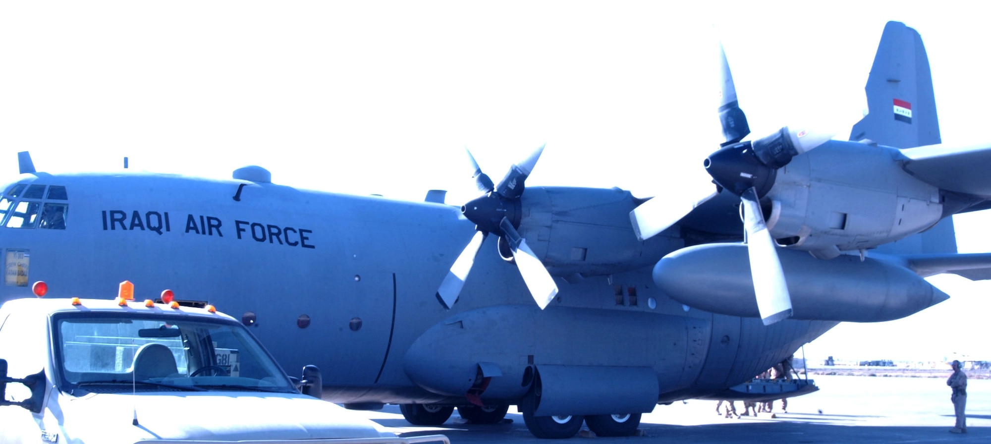 An Iraqi Air Force C-130 sits on the runway at Balad Air Base, Iraq, awaiting cargo to be loaded. The Iraqi Air Force recently moved its first coalition cargo within the area of responsibility. (U.S. Air Force photo/Master Sgt. Kirk Clear)                                