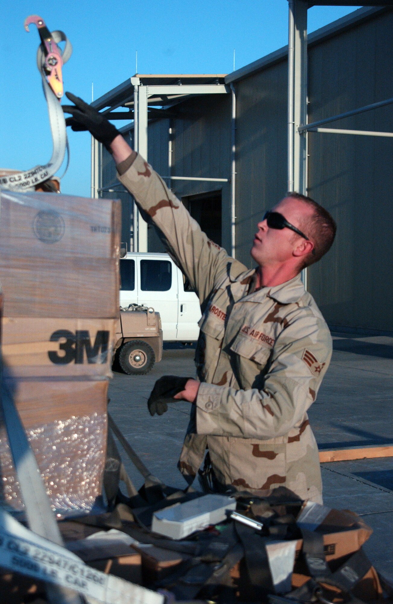BALAD AIR BASE, Iraq - Senior Airman Scott Maroste, 332nd Expeditionary air transportation cargo processor, breaks down a pallet here Nov. 24. Airman Maroste is deployed from Travis Air Force Base, Calif. (U.S. Air Force photo by Staff Sgt. Alice Moore)                                