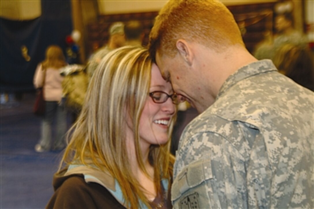 Spc. Matthew Smith and wife Letty are reunited at the homecoming ceremony for 4th Battalion, 23rd Infantry Regiment at Buckner Gym, Fort Richardson, Alaska, Nov. 25. The “Arctic Wolves” returned from a 16-month deployment to Iraq. 