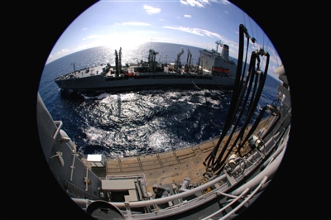 Okinawa, Japan (Nov. 27, 2006) - Military Sealift Command fleet replenishment oiler USNS Pecos pulls alongside amphibious assault ship USS Essex to provide the ship with diesel fuel marine and jet propulsion fuel during a replenishment at sea near Okinawa, Japan, Nov. 27. Essex is the Navy's only forward deployed amphibious assault ship and is the flagship for the Essex Expeditionary Strike Group based in Sasebo, Japan. 