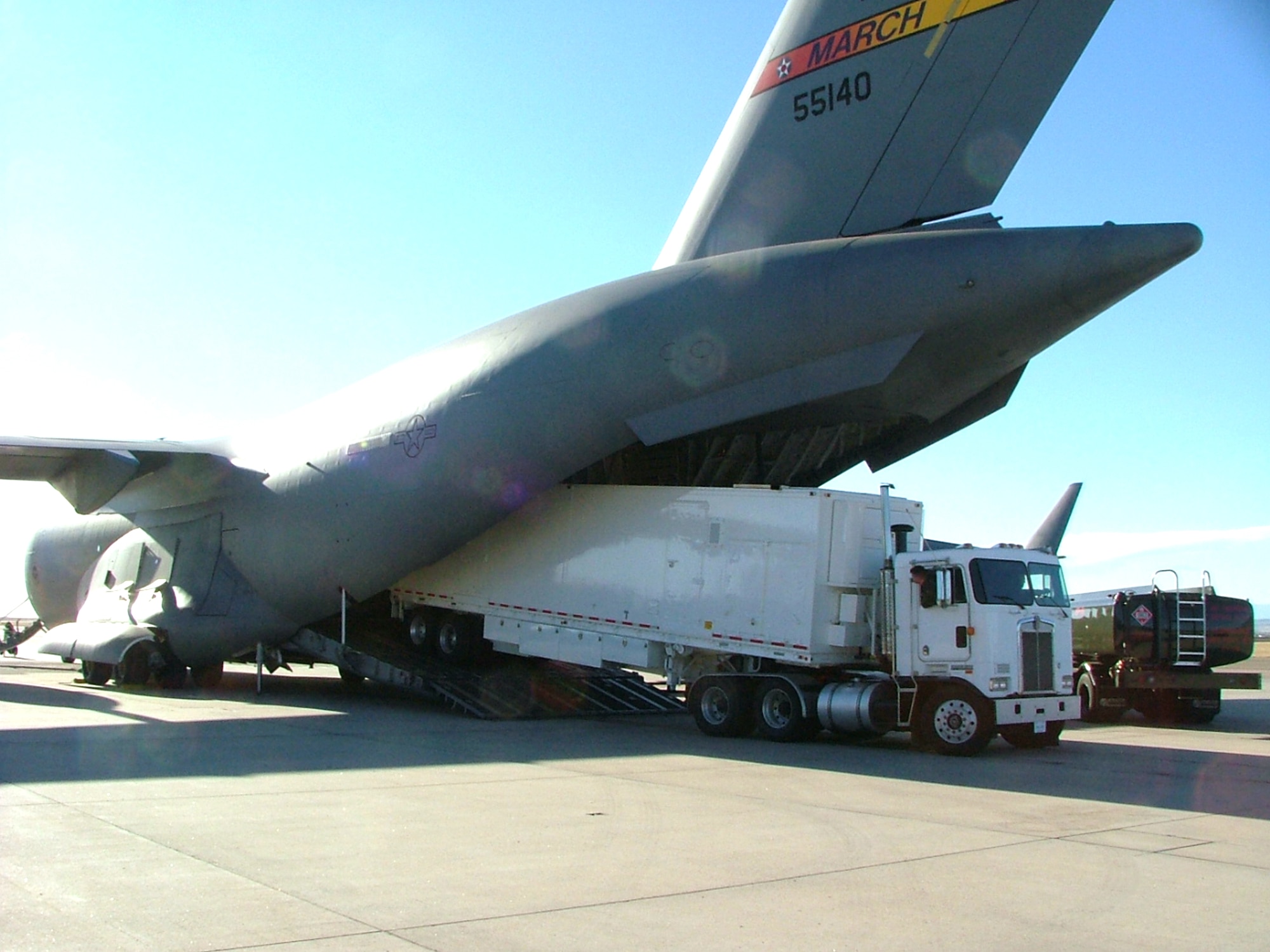 The 4th Space Operations Squadron's Mobile Operations Flight loads the Ground Mobile-3 vehicle into a C-17 Globemaster III Nov. 25 at Peterson Air Force Base, Colo. The GM-3 and a team of 4th SOPS Airmen from Schriever Air Force Base, Colo., will provide secure communication effects from their deployed location at Andersen AFB, Guam. (U.S. Air Force photo/Maj. Tommy Roberts)
