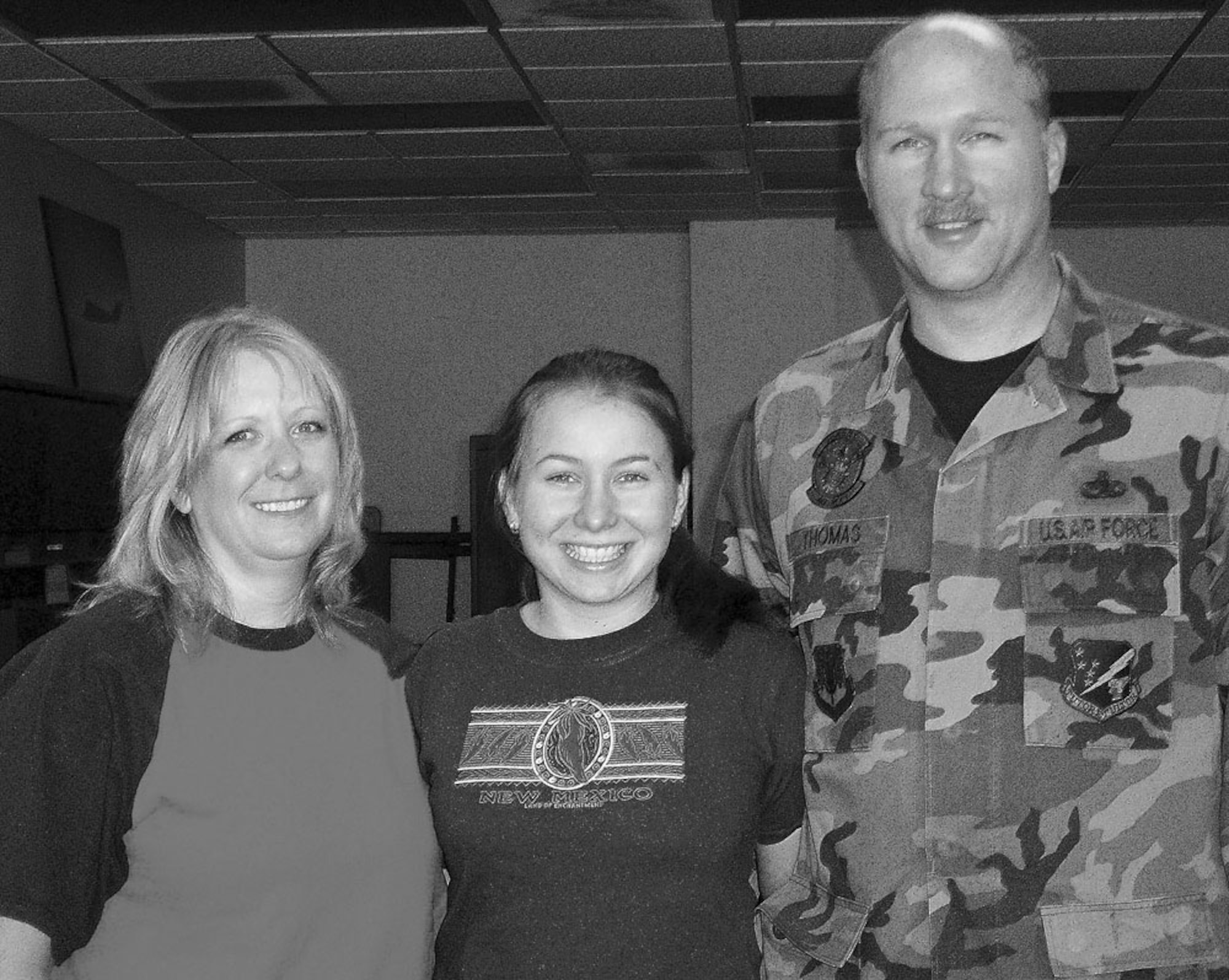 Katya, a Russian foreigh exchange student, and her "parents-away-from-home," Ms. Kelly Thomas and Master Sgt. Lewis Thomas. Katya has been in the U.S. since August with the FLEX program.
