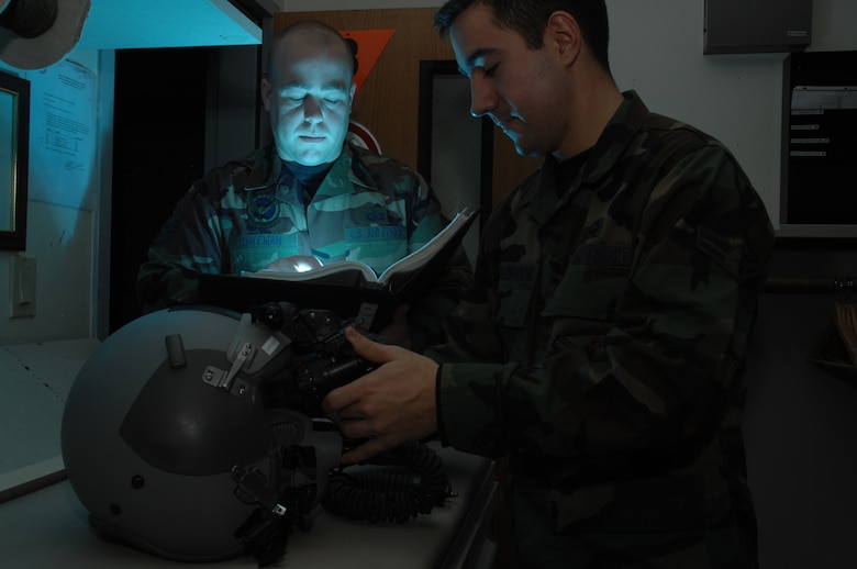 EIELSON AIR FORCE BASE, Alaska -- Airman First Class Andrew Witherspoon (right) adjust the eyespan on a pair of AN/AVS-9 Night Vision Goggles (NVG's) while Staff Sgt Timothy Huffman consults the Technical Order in the Life Support Section of the 355th Fighter Squadron here on 29 Nov. During the winter months pilots of Eielson Air Force Base, Alaska are given a greater opportunity to train with NVG's more than their counterparts in the lower 48 states due to the decrease length of sunlight.
(U.S. Air Force Photo by Staff Sgt Joshua Strang)