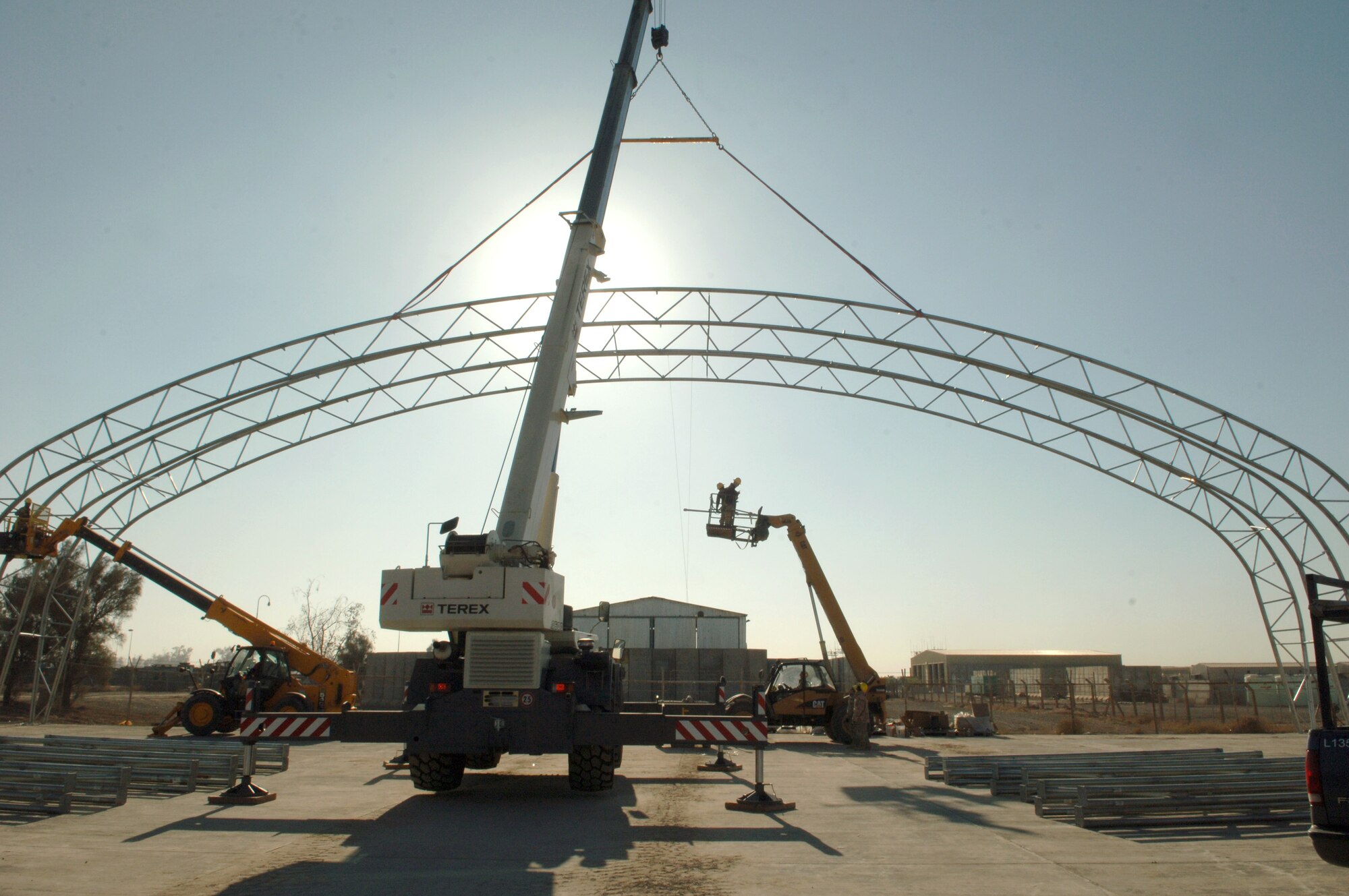 Airmen from the 332nd Expeditionary Civil Engineer Squadron Structures shop continue construction Nov. 26 on the new Hunter Unmanned Aerial Vehicle shelter. The 20-day project at Balad Air Base, Iraq., will take approximately 3,200 man hours to complete. (U.S. Air Force photo/Airman 1st Class Chad M. Kellum)


