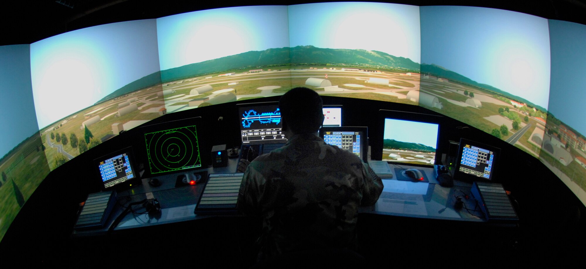 Tech. Sgt. Kevin Cobb uses the air traffic control simulator Nov. 28 at Aviano Air Base, Italy. The simulator is used to train air traffic controllers on specific situations unique to Aviano AB. It can also be used to train outgoing members on their future bases' airspace scenarios. Sergeant Cobb is a member of the 31st Operations Support Squadron. (U.S. Air Force photo/Airman 1st Class Michael S. Dorus)
