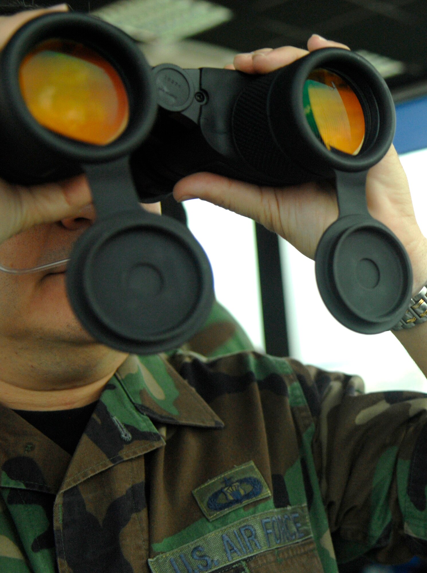 Tech. Sgt. Ricardo Anzoategui looks out toward incoming aircraft Nov. 28 at Aviano Air Base, Italy. Air traffic controllers perform duties within a radar facility and maintain radar surveillance of approach control airspace, processing and coordinating aircraft through terminal control. Sergeant Anzoategui is a tower watch supervisormember for the 31st Operations Support Squadron. (U.S. Air Force photo/Airman 1st Class Michael S. Dorus)
