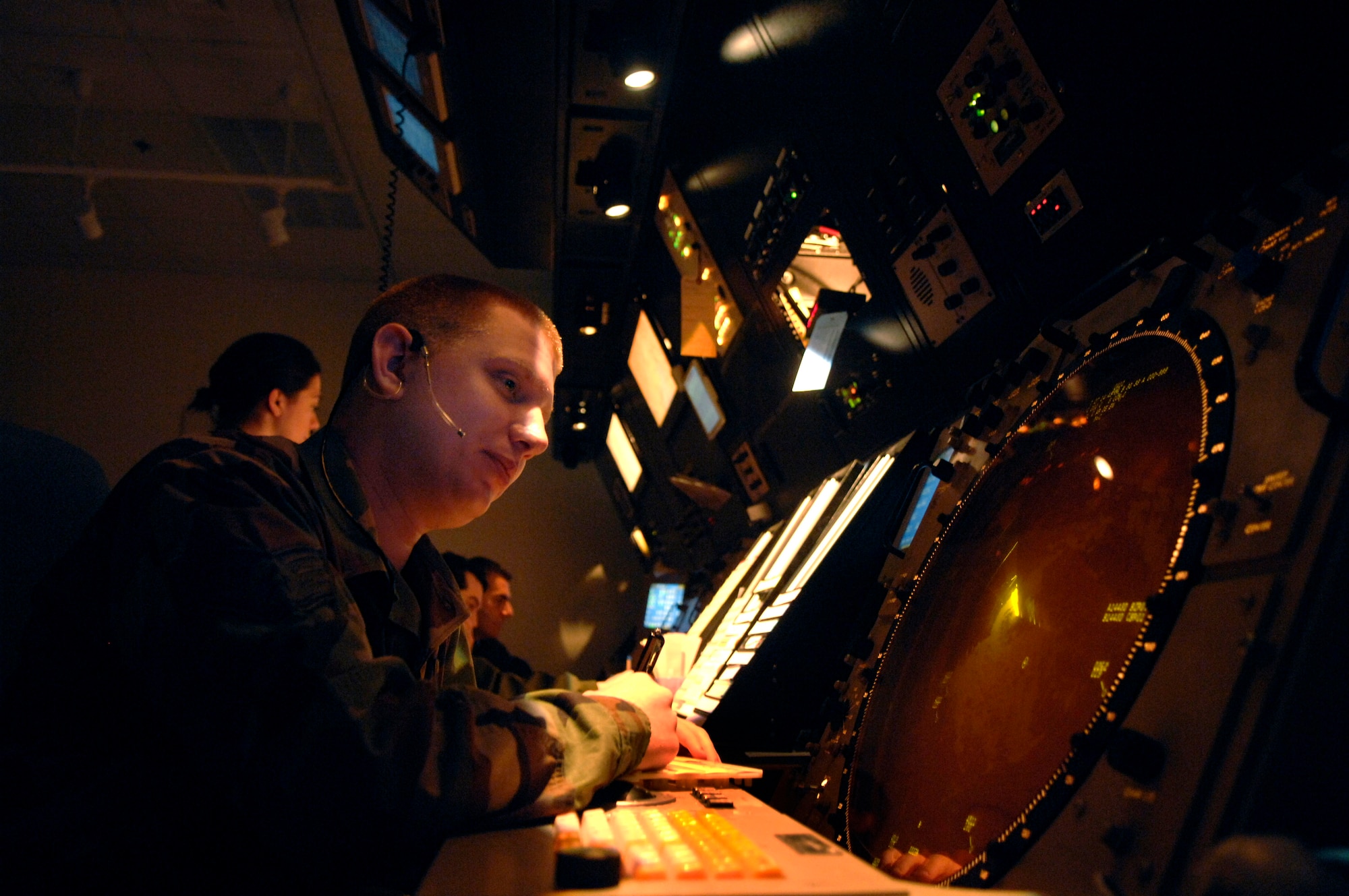 Staff Sgt. Jeffrey Klein provides expeditious airflow for aircraft flying Nov. 27 over Aviano Air Base, Italy. Air traffic controllers perform duties within a radar facility and maintain radar surveillance of approach control airspace, processing and coordinating aircraft through terminal control. Sergeant Klein is an arrival controller at Aviano AB. (U.S. Air Force photo/Airman 1st Class Michael S. Dorus)
