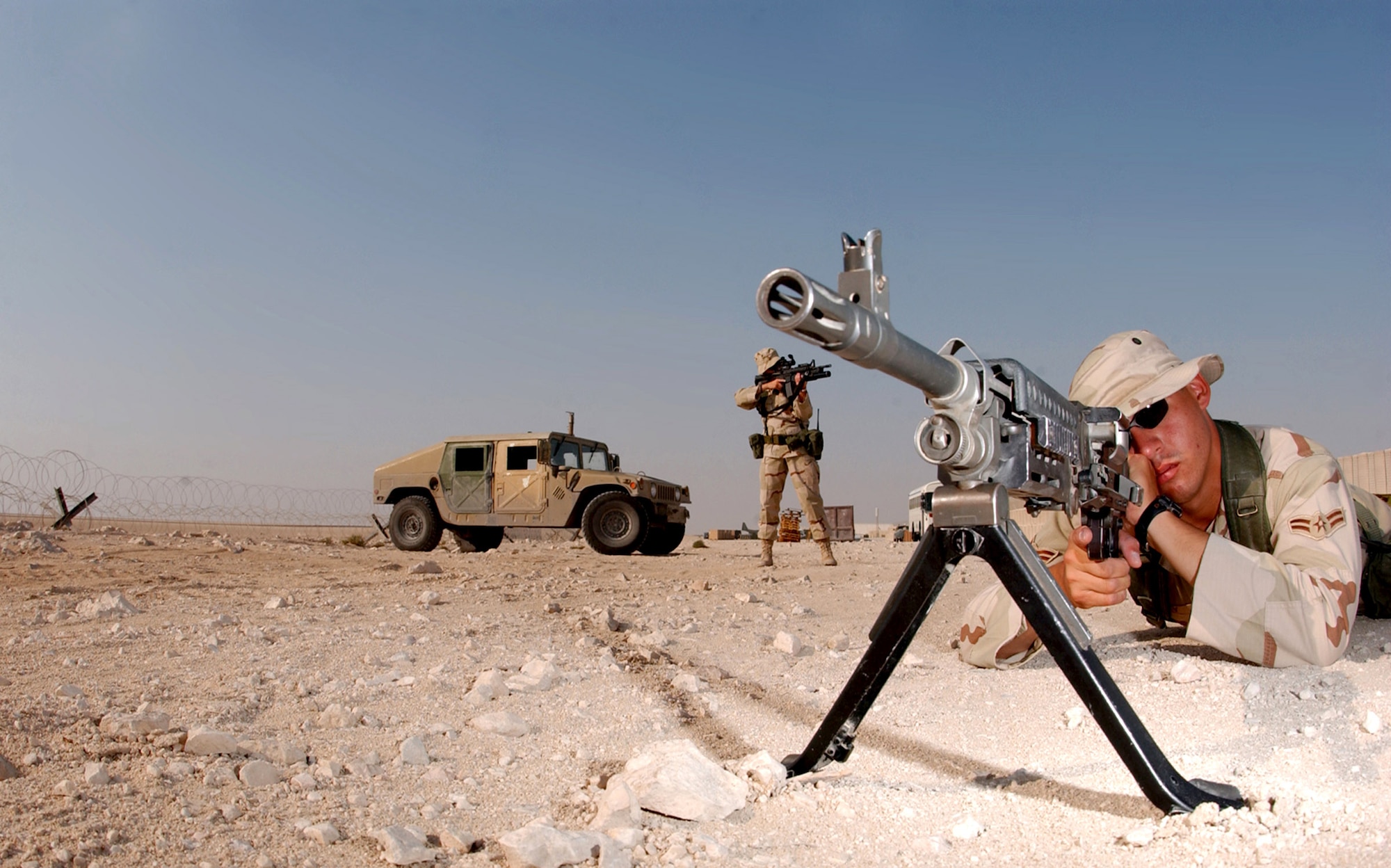 Airman 1st Class Joshua Hurley and Airman 1st Class Ashley-Marie Wilson, both with the 379th Security Forces Squadron, maintain watch somewhere in the deserts of Southwest Asia.  (U.S. Air Force photo/Senior Airman Ricky Best) 

