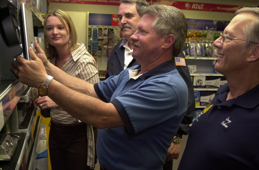 (Photo by Frank McIntyre) Enlisted Appreciation Night co-chairman Richard Johndrow picks out prizes with (far left) Ricki Crabtree, Enid Chamber of Commerce, Vance Fire Chief Ron Diener and George Pankonin. Food, fun and prizes are featured for Vance AFB’s enlisted people.