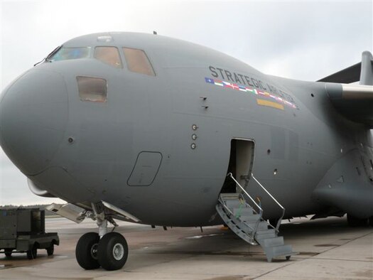 A C-17 sits on display in Riga, Latvia, where its capabilities were displayed Nov. 27 to NATO Secretary General Jaap de Hoop Scheffer, the president of Latvia, and senior alliance military officials – including Gen. Tom Hobbins, Allied Air Component Commander and U.S. Air Forces in Europe Commander. 
The cargo aircraft, flown to Latvia as part of the Riga Summit by aircrew members from the 62nd Airlift Wing at McChord Air Force Base, Wash., showcased a joint initiative by 15 NATO member countries and partner country Sweden to purchase C-17 transport aircraft in order to provide strategic airlift capability for NATO and other missions, according to a NATO news release.
The capability will initially comprise three C-17s, flown and maintained by multinational aircrews under the command of a multinational military structure.
The aircraft will be used for missions which may be purely national in character but could also be allocated to NATO operations or for United Nations, European Union or other international purposes such as humanitarian relief.
