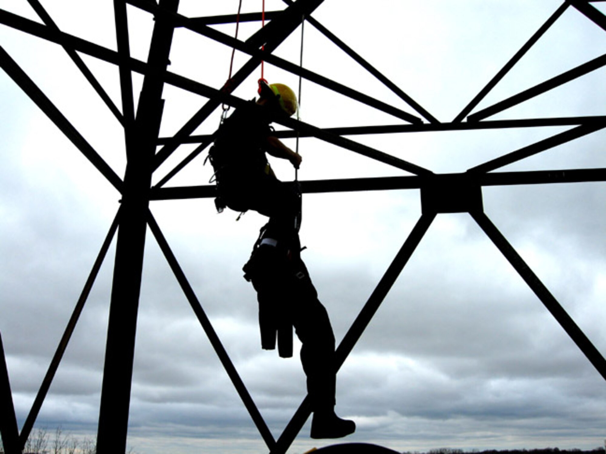 GRISSOM AIR RESERVE BASE, Ind -- What looks like a web of safety is actually Dan Wolf, a first responder with the Grissom Fire Department, lowering an "unconscious victim" from an old weather tower druing a recent exercise held at the base.  Grissom played host for a state-wide exercise for area fire departments to test their skills. (U.S. Air Force photo/Mr. Keith Parker)
