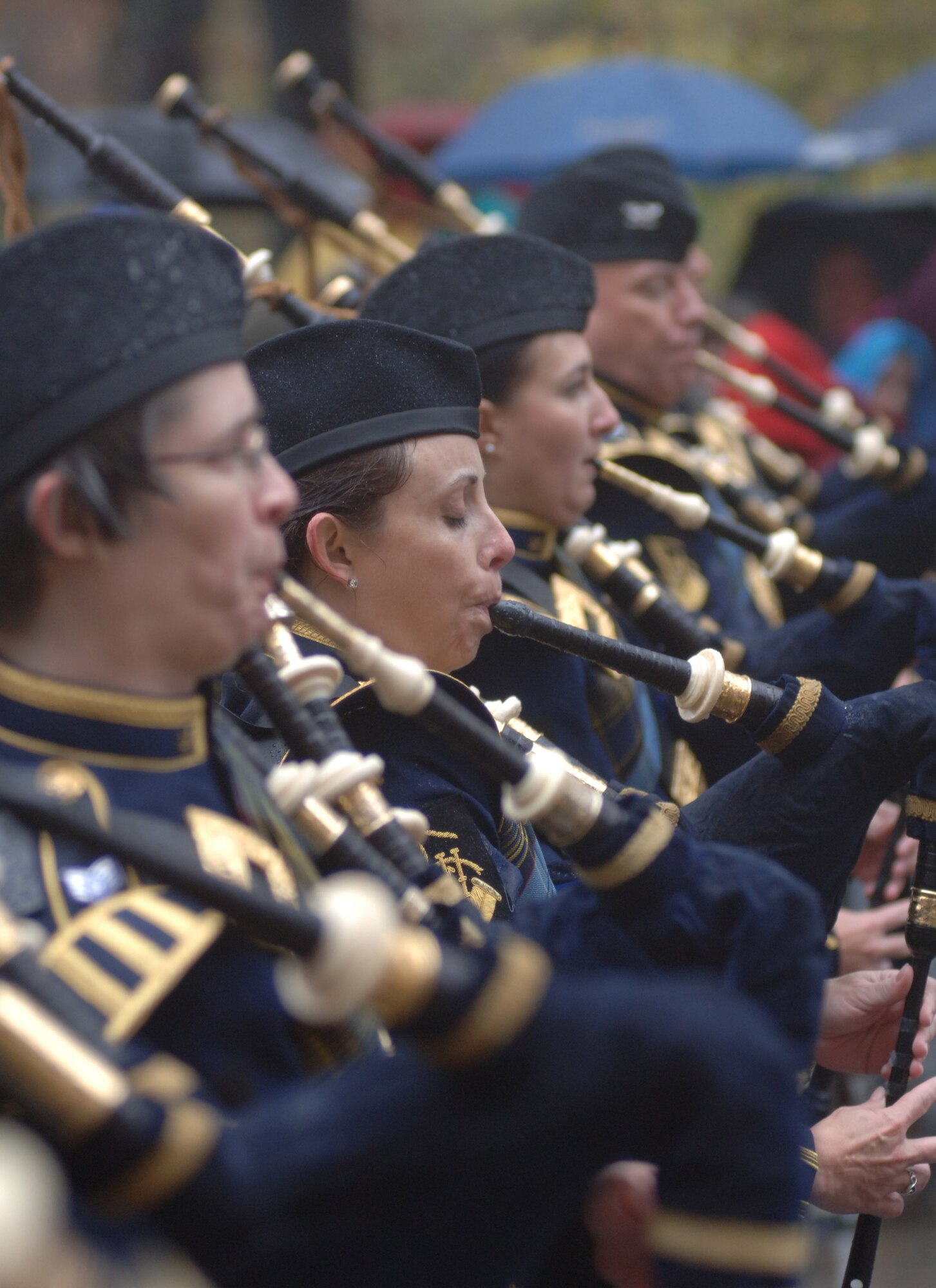 The Air Force Reserve Pipe Band marched with the U.S. Air Force Academy Band in the Macy's Thanksgiving Day Parade Nov. 23 in New York City despite heavy rains and near-freezing temperatures. Between two major networks the Macy's parade reaches an estimated 55 million people worldwide. The appearance was part of a five-day tour by the academy band, accompanied by the cadet chorale and falconers, in which it had five national television appearances. (U.S. Air Force photo/1st Lt. John Ross)