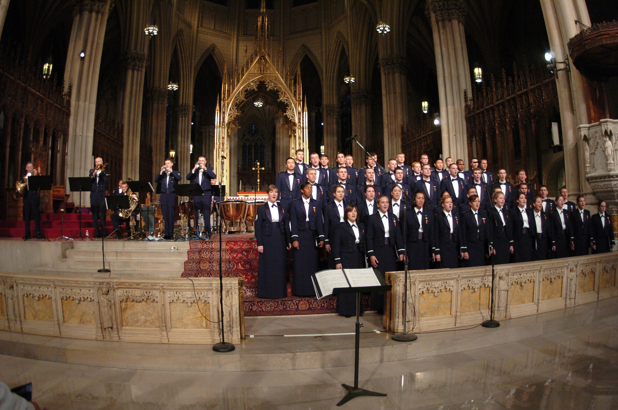 The U.S. Air Force Academy Cadet Chorale and Stellar Brass perform the first movement of "Gloria" by John Rutter Nov. 24 in New York City's St. Patrick's Cathedral. Between the full-house audience and 11 subsequent television and radio broadcasts of the concert, an estimated 1 million people heard the concert. The performance was part of a five-day tour by the academy band, accompanied by the cadet chorale and falconers, in which it had five national television appearances. (U.S. Air Force photo/1st Lt. John Ross) 