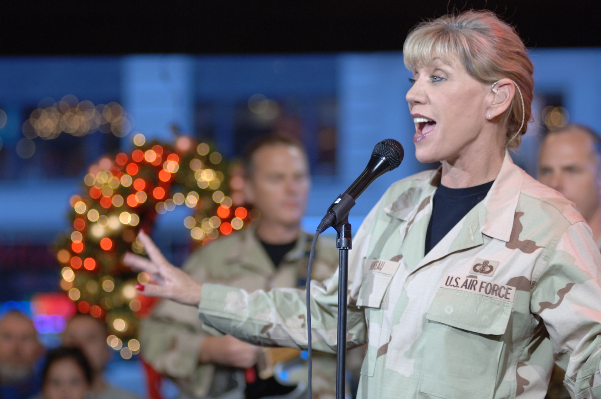 Chief Master Sgt. Marcie Hureau sings with Wild Blue Country on Good Morning America Nov. 24 in New York City. The performance was part of a five-day tour by the U.S. Air Force Academy Band, accompanied by the cadet chorale and falconers, in which it had five national television appearances. (U.S. Air Force photo/1st Lt. John Ross) 