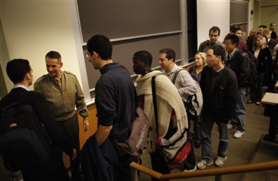Chairman of the Joint Chiefs of Staff Marine Gen. Peter Pace shakes hands with Wharton masters of business administration students after a lecture at the University of Pennsylvania campus in Philadelphia, Nov. 28, 2006.  Established in 1881, the school is the world's first collegiate business school. 