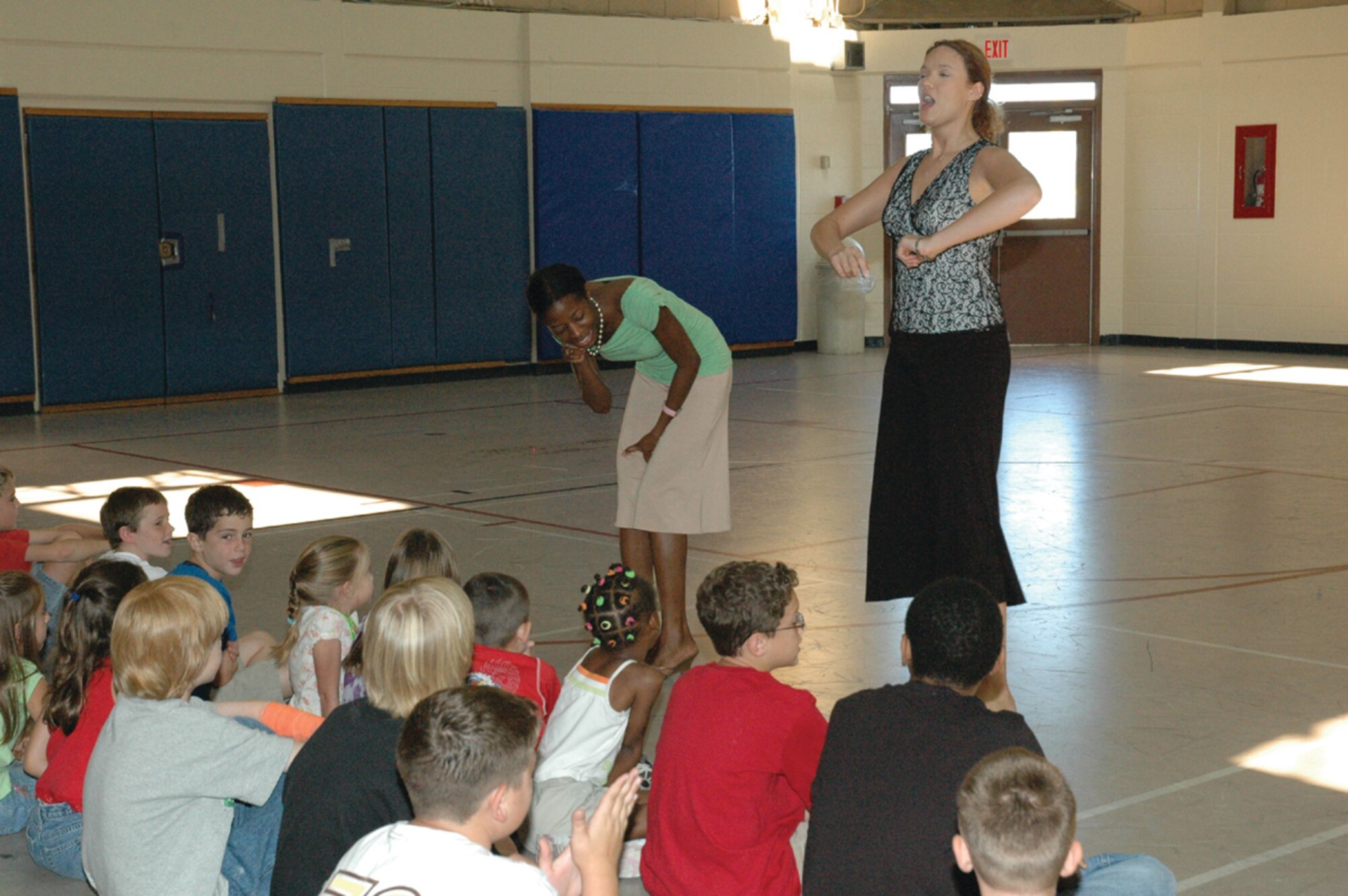 TYNDALL AIR FORCE BASE, Fla. --  Jamie Butler and Amanda Dyke from the Missoula Children’s theater, tell Youth Center children what they are looking for in their auditions June 26. More than 30 children auditioned and all will be performing tonight in “Robin Hood” at 6:30 tonight at the center. (U.S. Air Force photo by Chrissy Cuttita)