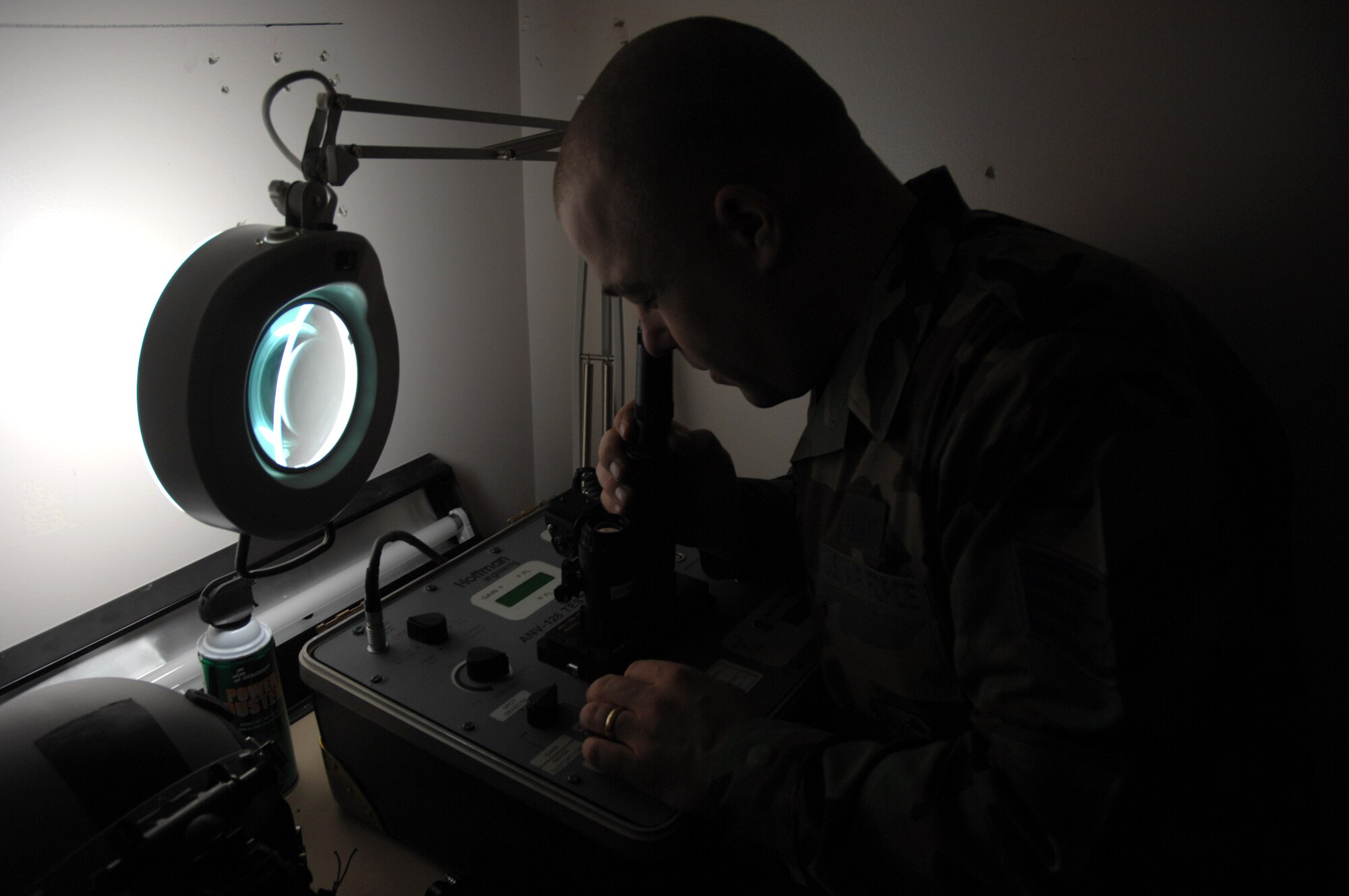 Staff Sgt. Timothy Huffman checks for lens defects on a pair of AS/AVS-9 Night Vision Goggles in the life support section of the 355th Fighter Squadron Nov. 29 at Eielson Air Force Base, Alaska. During the winter months, pilots at Eielson AFB are given a greater opportunity to train with NVG's more than their counterparts in the lower 48 states due to the decreased length of sunlight. (U.S. Air Force photo/Staff Sgt. Joshua Strang) 
