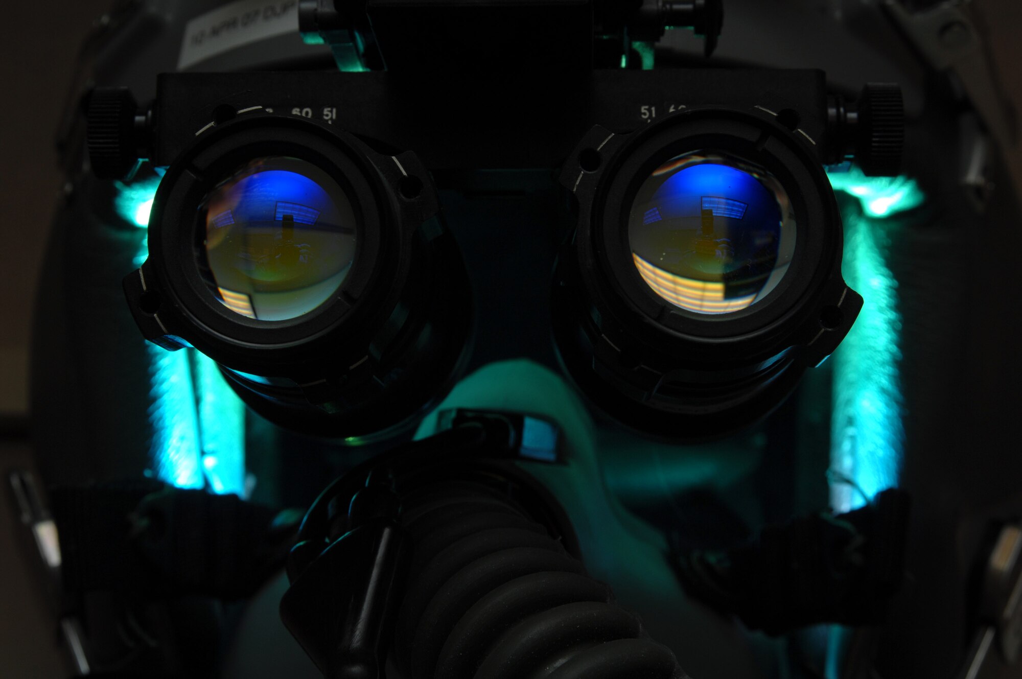 AS/AVS-9 Night Vision Goggles sit atop a fighter pilot's helmet in the life support section of the 355th Fighter Squadron Nov. 29 at Eielson Air Force Base, Alaska. During the winter months, pilots of Eielson AFB are given a greater opportunity to train with NVG's more than their counterparts in the lower 48 states due to the decreased length of sunlight. (U.S. Air Force photo/Staff Sgt. Joshua Strang)