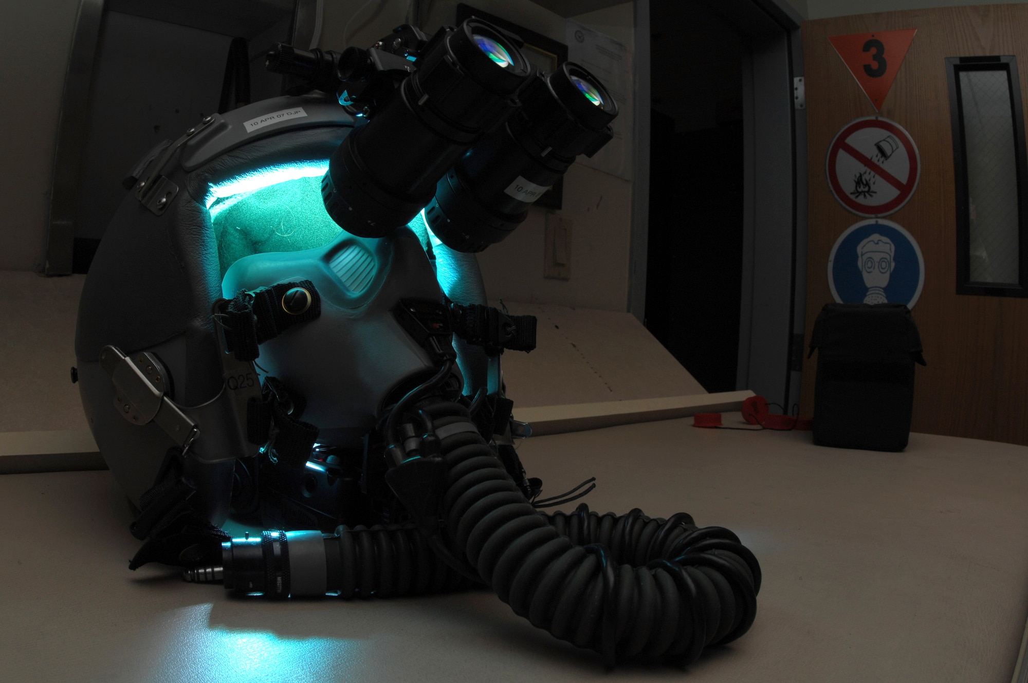 AS/AVS-9 Night Vision Goggles sit atop a fighter pilot's helmet in the life support section of the 355th Fighter Squadron Nov. 29 at Eielson Air Force Base, Alaska. During the winter months, pilots of Eielson AFB are given a greater opportunity to train with NVG's more than their counterparts in the lower 48 states due to the decreased length of sunlight. (U.S. Air Force photo/Staff Sgt. Joshua Strang)